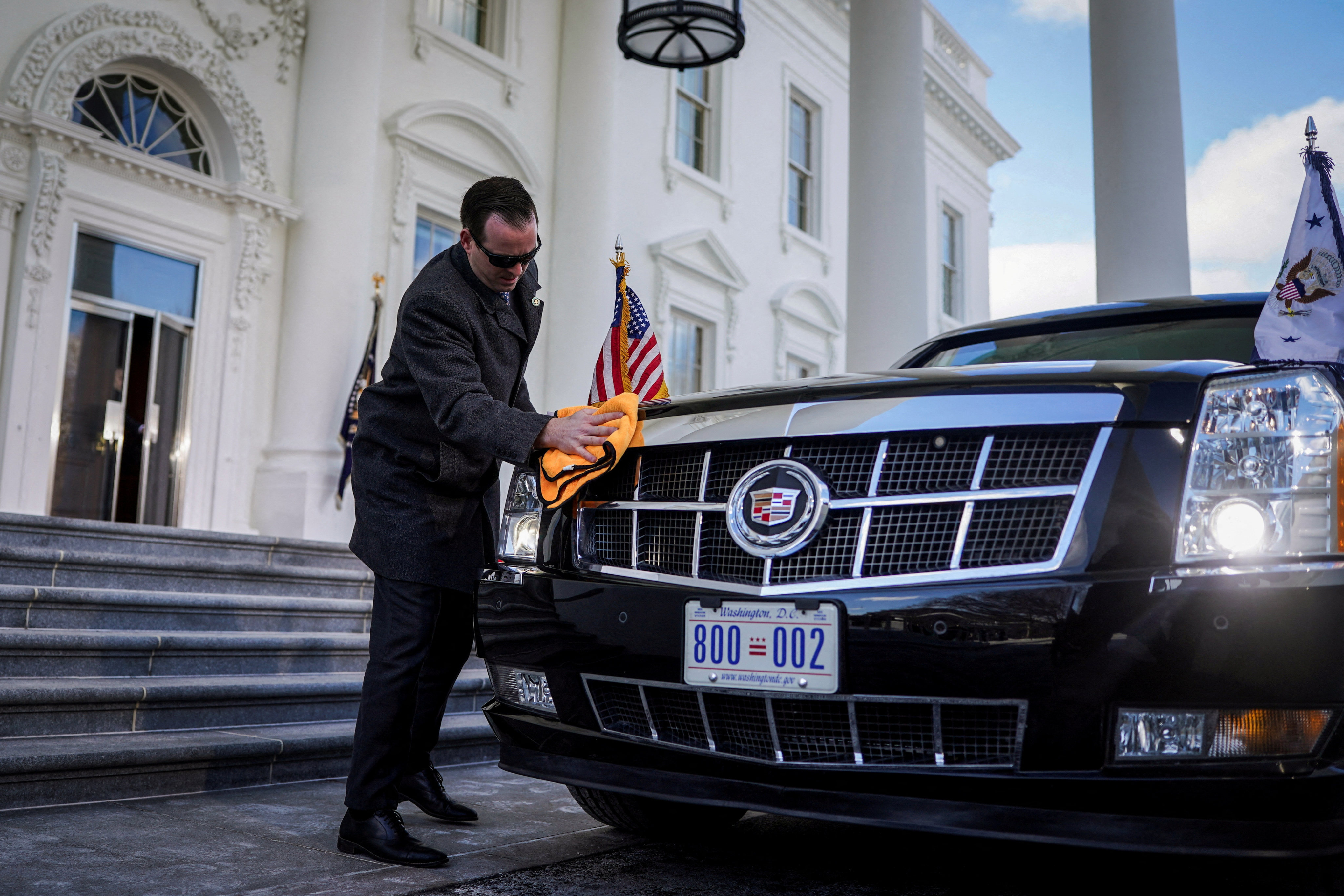 A worker cleans the armoured presidential vehicle at the White House on January 20. Photo: Reuters