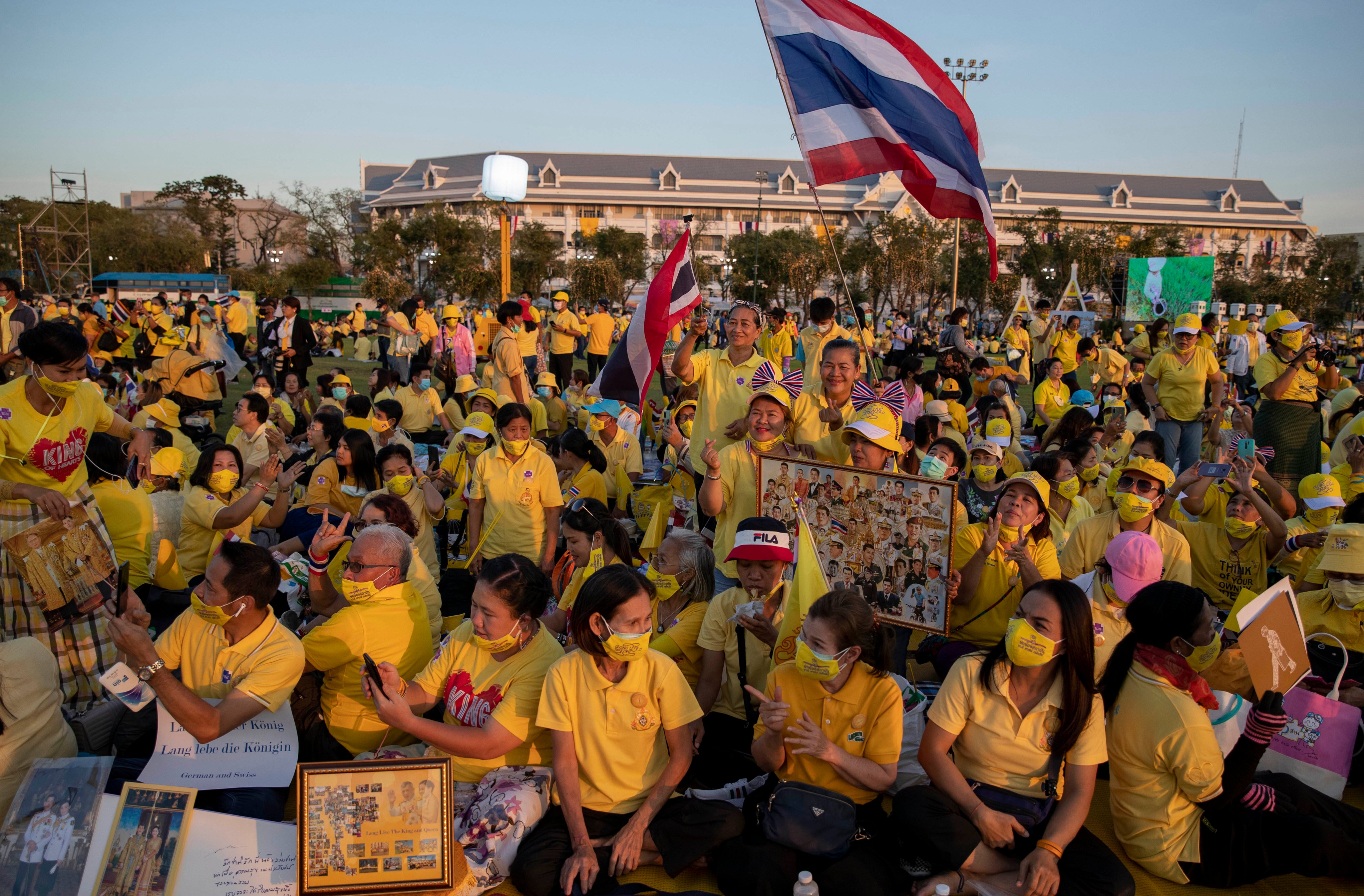 Supporters of Thai monarchy display images of King Maha Vajiralongkorn, Queen Suthida and the late King Bhumibol Adulyadej during an event in December 2020. Thailand’s monarchy is protected from criticism by a lese-majeste law. Photo: AP