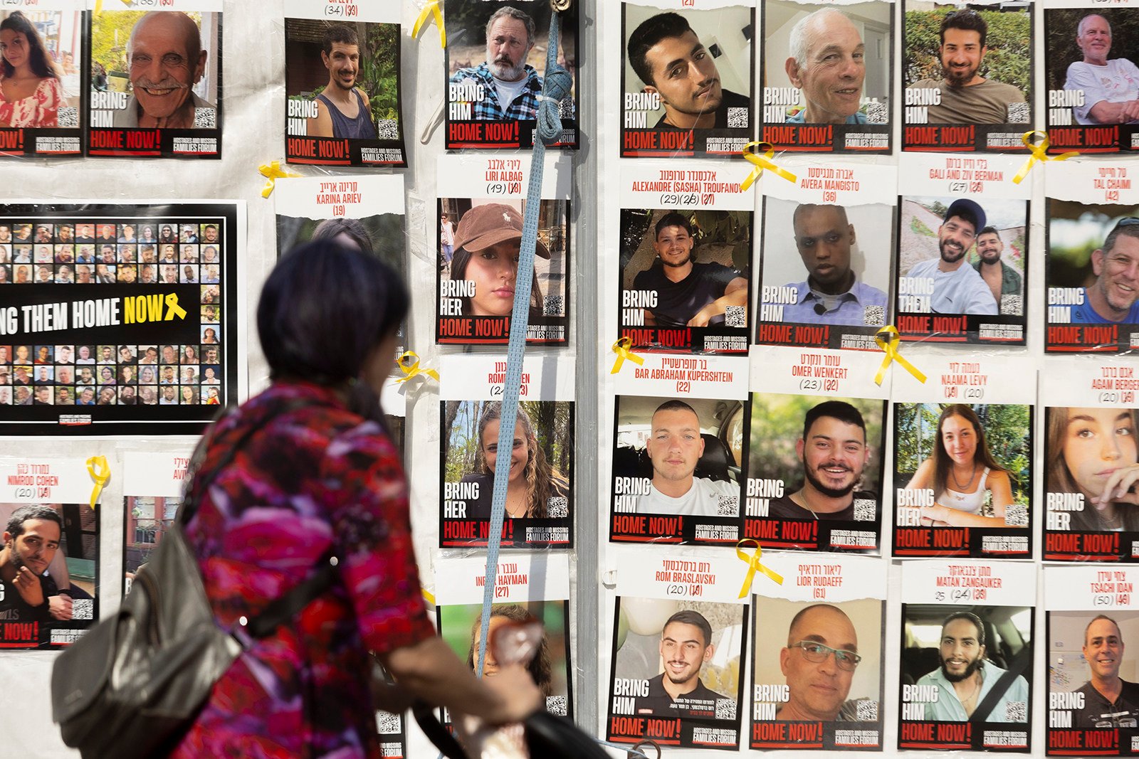 A wall in Tel Aviv covered with photos of hostages held in the Gaza Strip. Photo: TNS