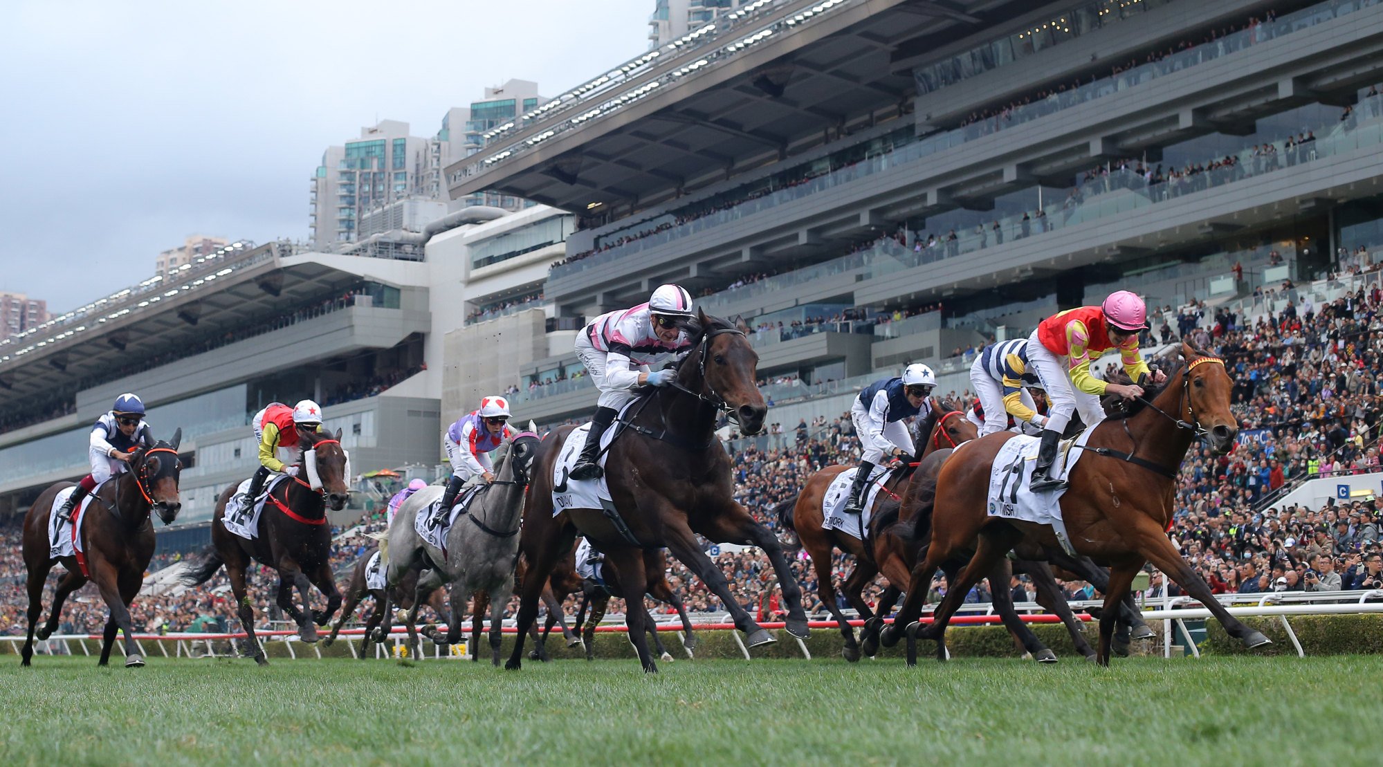 My Wish wins the Classic Mile in front of a huge crowd at Sha Tin.