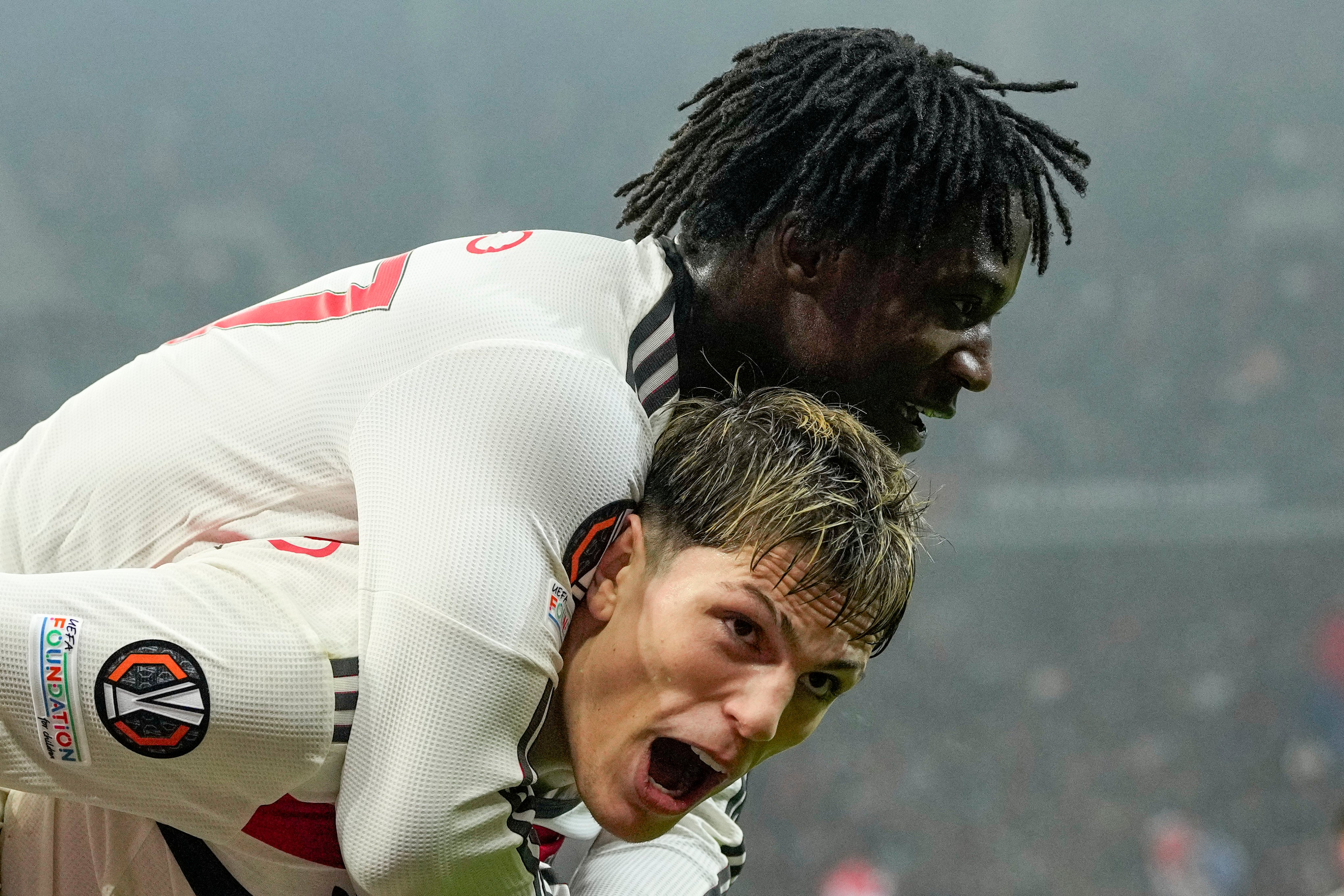 Manchester United’s Kobbie Mainoo celebrates with Alejandro Garnacho after scoring his side’s second against FCSB at the National Arena stadium. Photo: AP