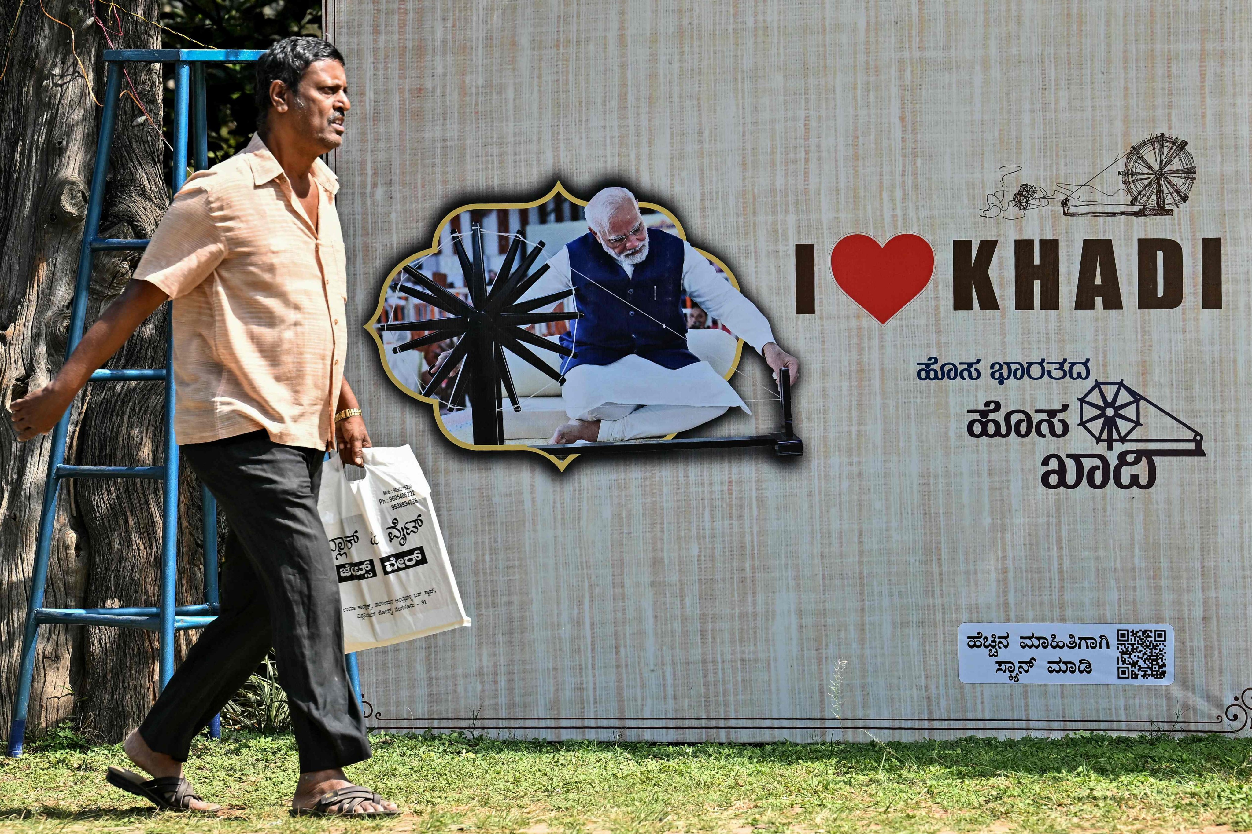 A man walks past a poster of India’s Prime Minister Narendra Modi at Freedom Park in Bengaluru on January 4. Photo: AFP