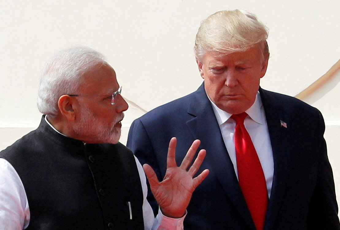 US President Donald Trump and India’s Prime Minister Narendra Modi talk as they arrive for a joint news conference at Hyderabad House in New Delhi, India, on February 25, 2020. Photo: Reuters