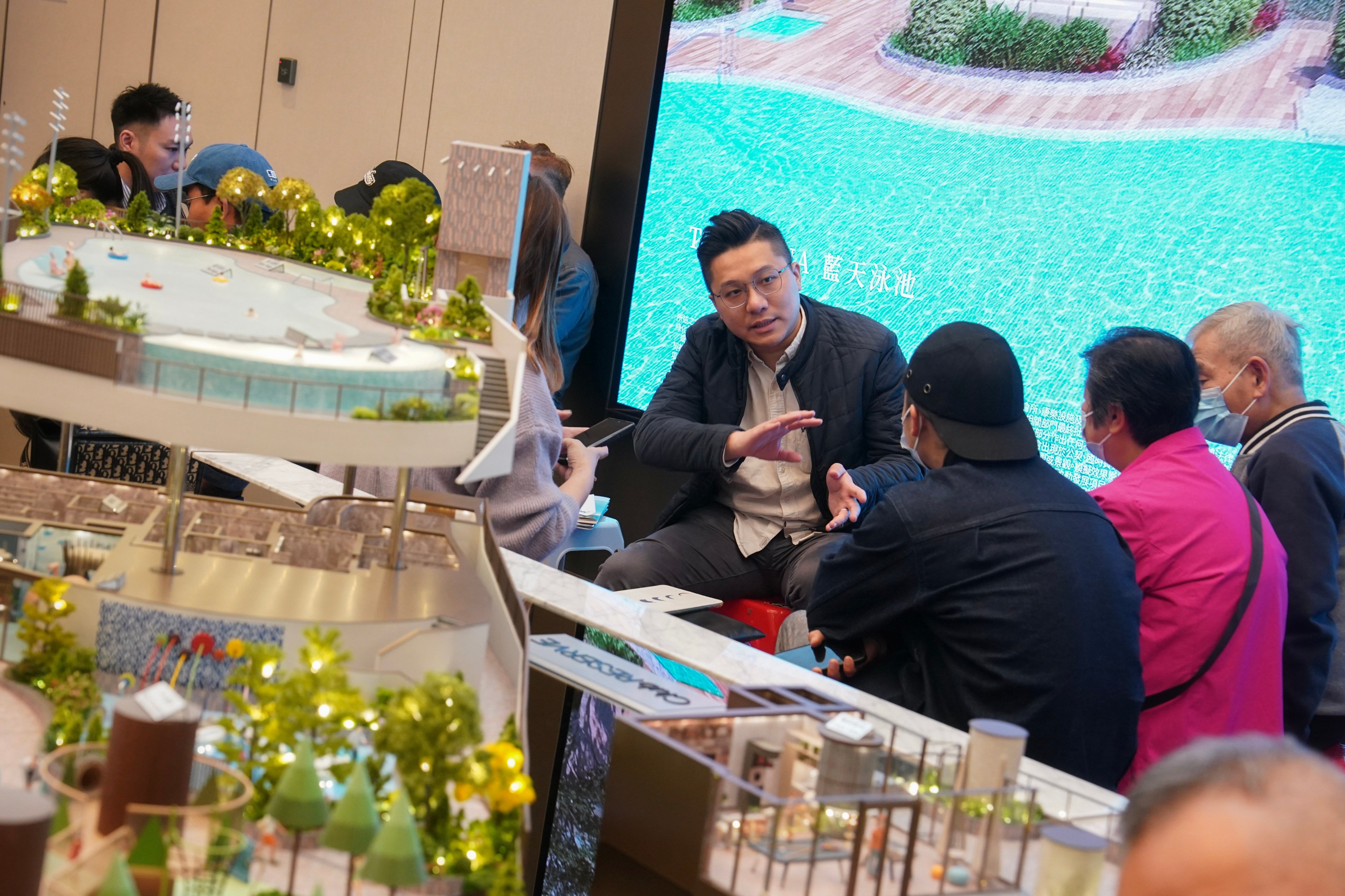 Property agents and potential buyers at the sales office of The Reserve on Saturday. Photo: Elson Li