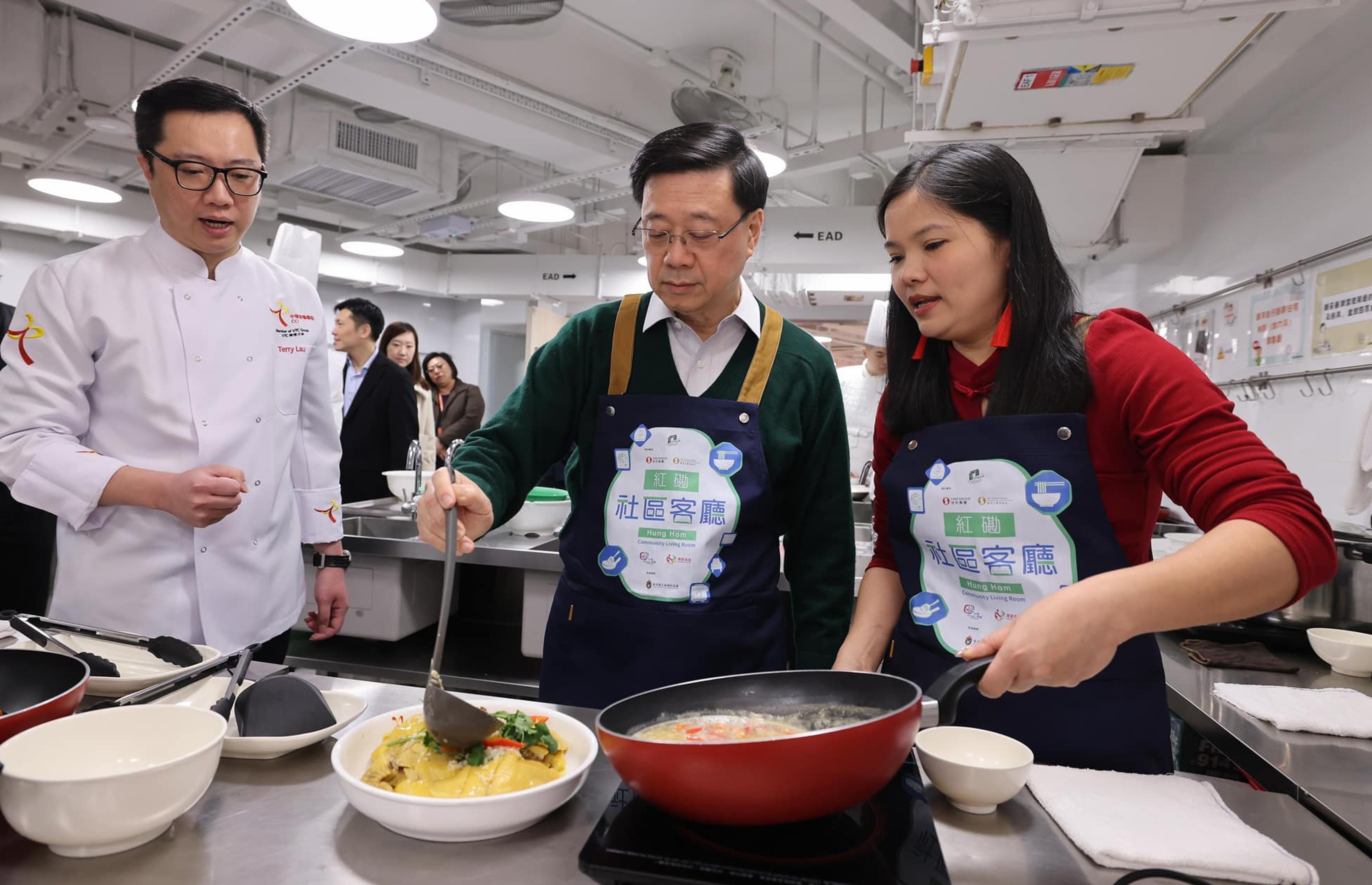 Chief Executive John Lee Ka-chiu assists with cooking at the Hung Hom community living room. Photo: Facebook / John KC Lee