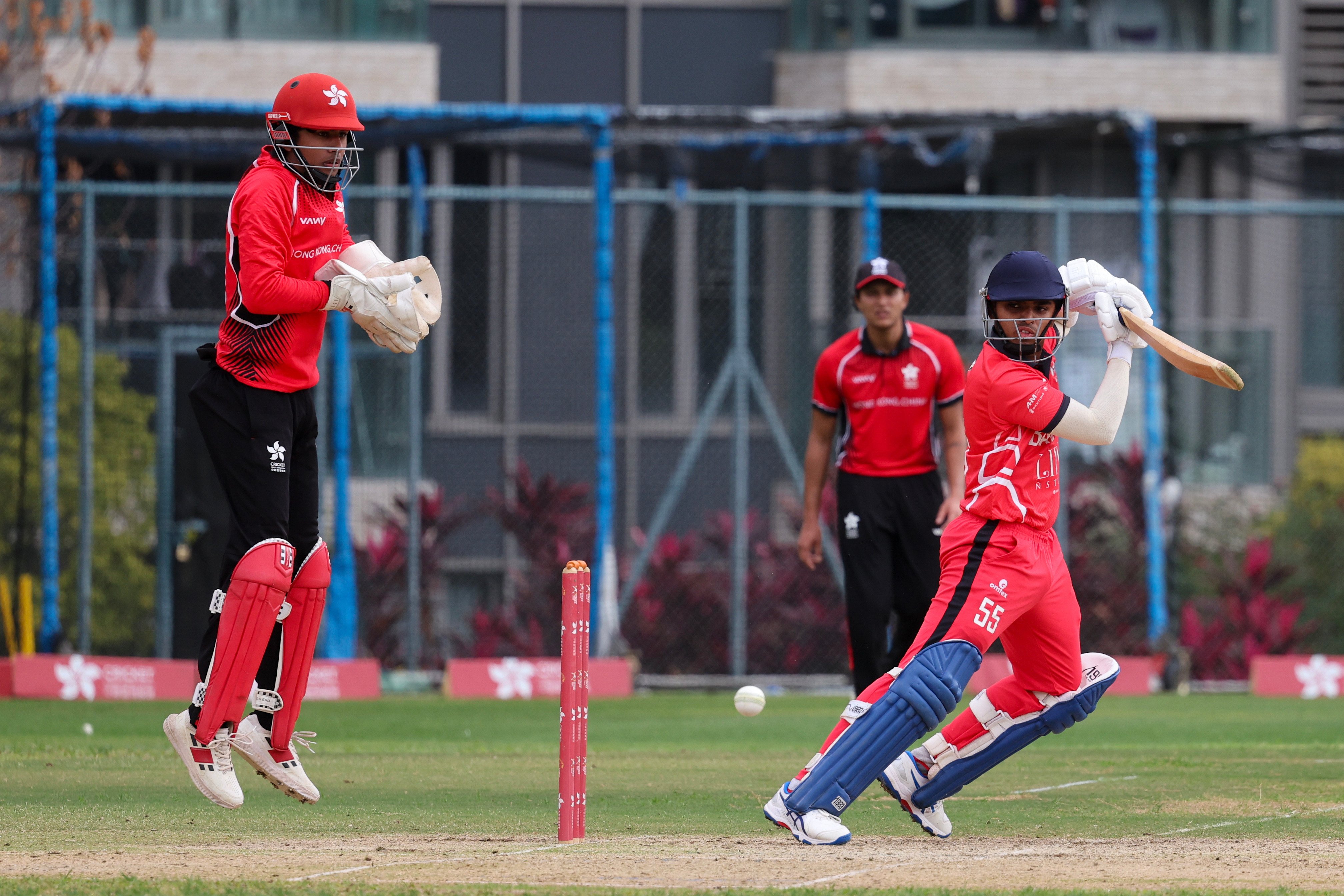 Wicketkeeper Shiv Mathur watches the ball disappear off the bat of Bahrain’s Muhammed Basil. Photo: Dickson Lee
