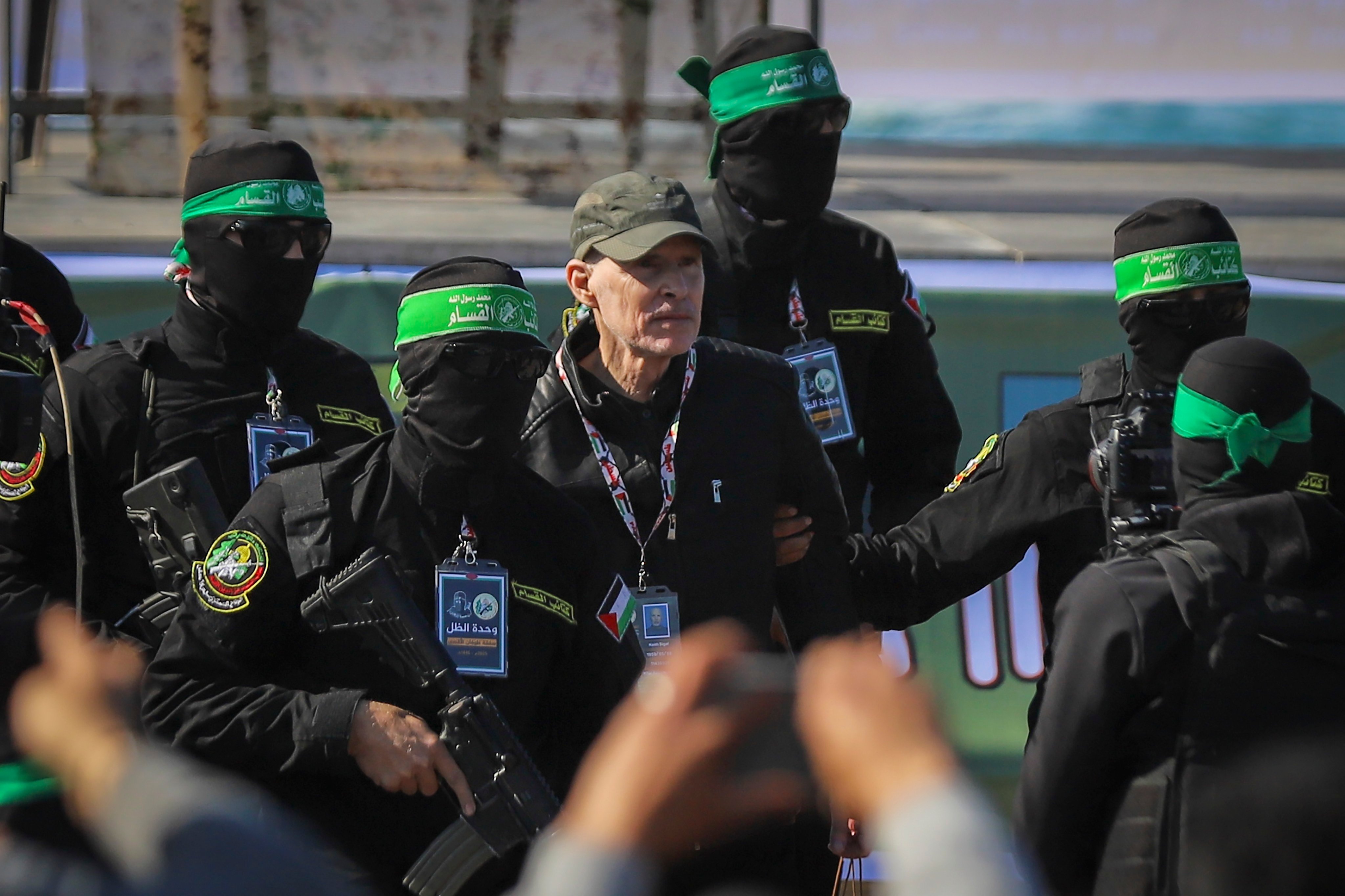 American-Israeli hostage Keith Siegel, 65, is escorted by Hamas fighters as he is handed over to the Red Cross in Gaza City, on Saturday. Photo: AP