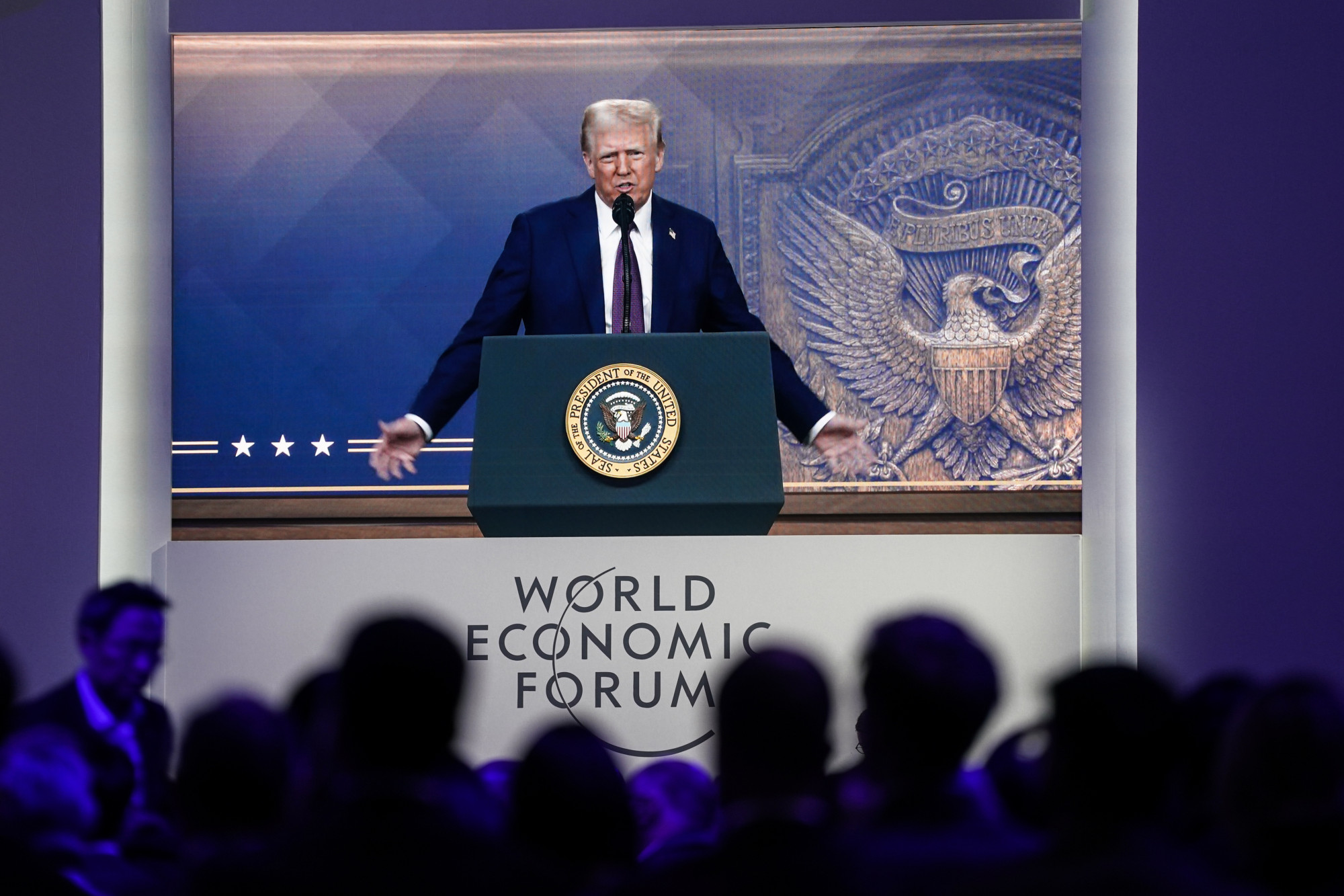People watch US President Donald Trump speak via video link to the World Economic Forum meeting in Davos on January 23. Photo: Xinhua
