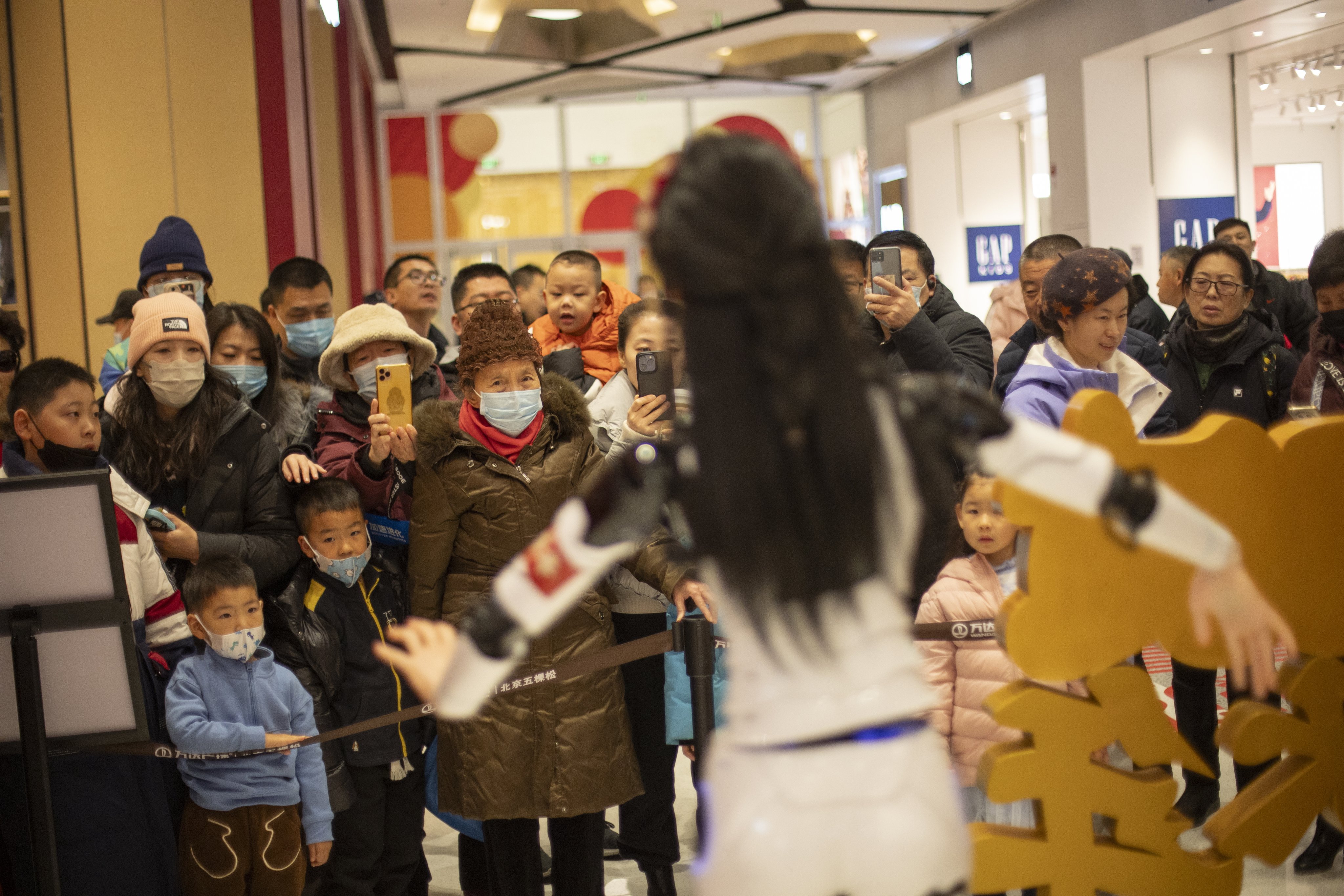 A humanoid robot named Xiao Xin entertained shoppers at a Beijing mall, showcasing the latest advancements in AI. Photo:  EPA-EFE