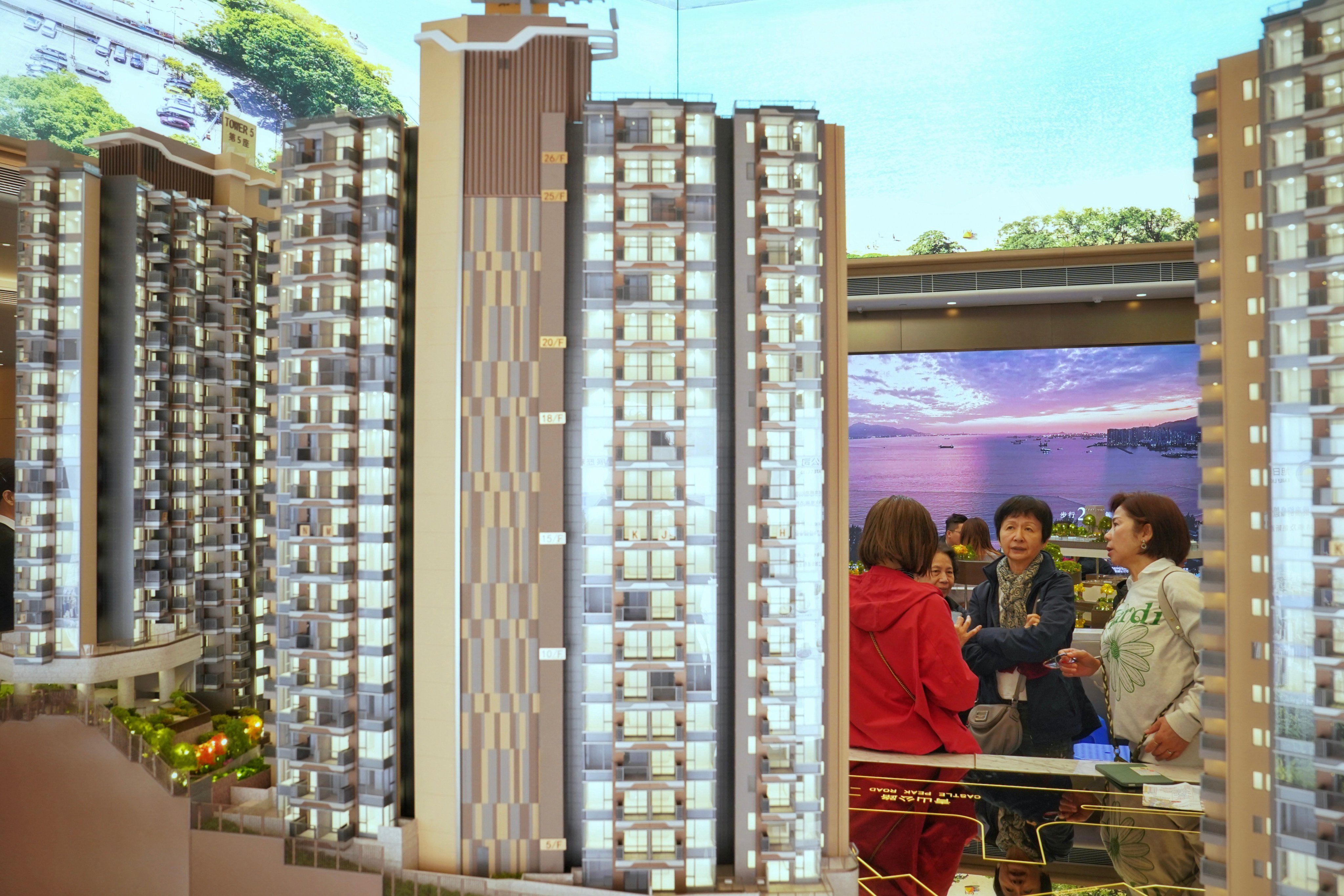 Property agents and potential buyers visit the sales office for a new residential development in Hong Kong’s Tuen Mun district, on February 1. Photo: Elson Li