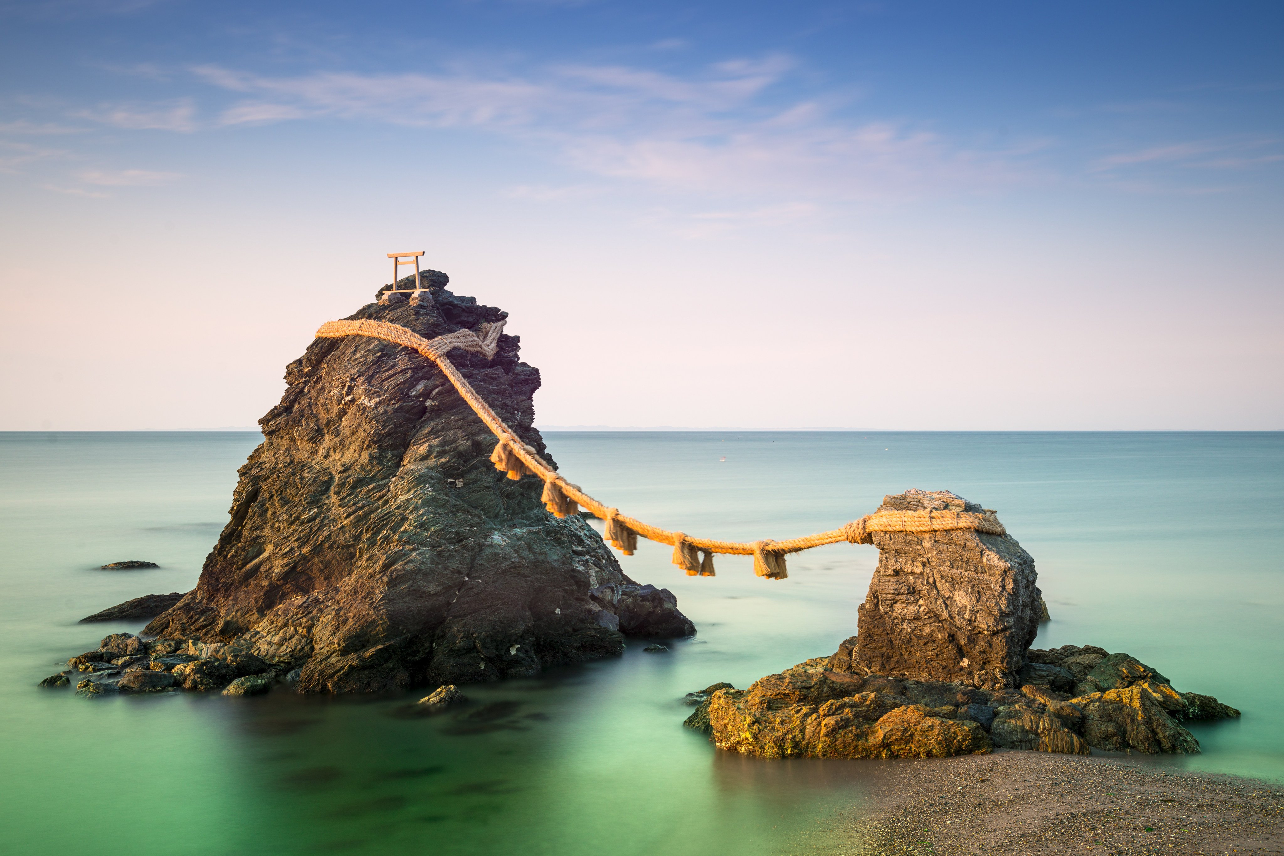 Meoto Iwa Rocks, Futami, Mie Prefecture, Japan. Known in English as the &quot;wedded rocks,&quot; they are considered sacred and represent husband and wife. Shutterstock