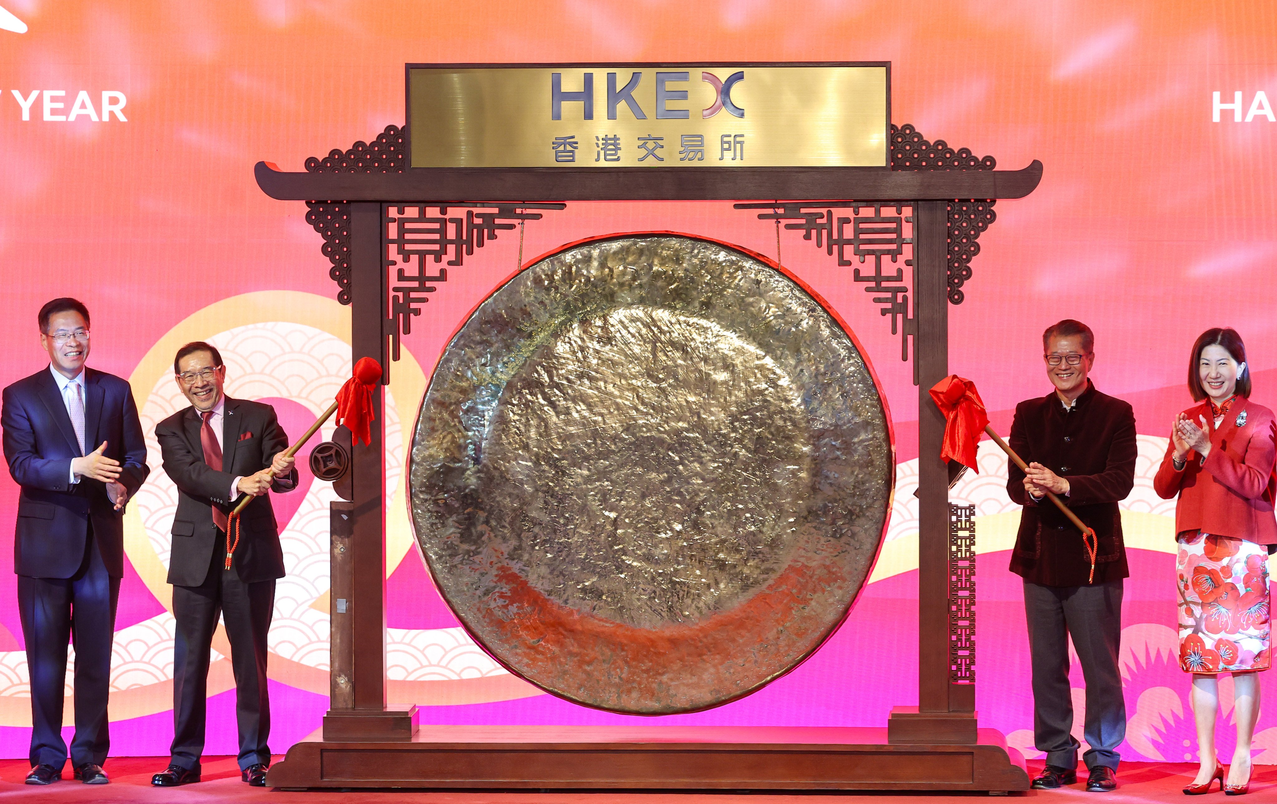 (From left)Central government liaison office deputy Qi Bin, HKEX chairman Carlson Tong, Financial Secretary Paul Chan, and HKEX CEO Bonnie Chan attend the Lunar New Year ceremony at the Hong Kong stock exchange on Monday. Photo: Edmond So