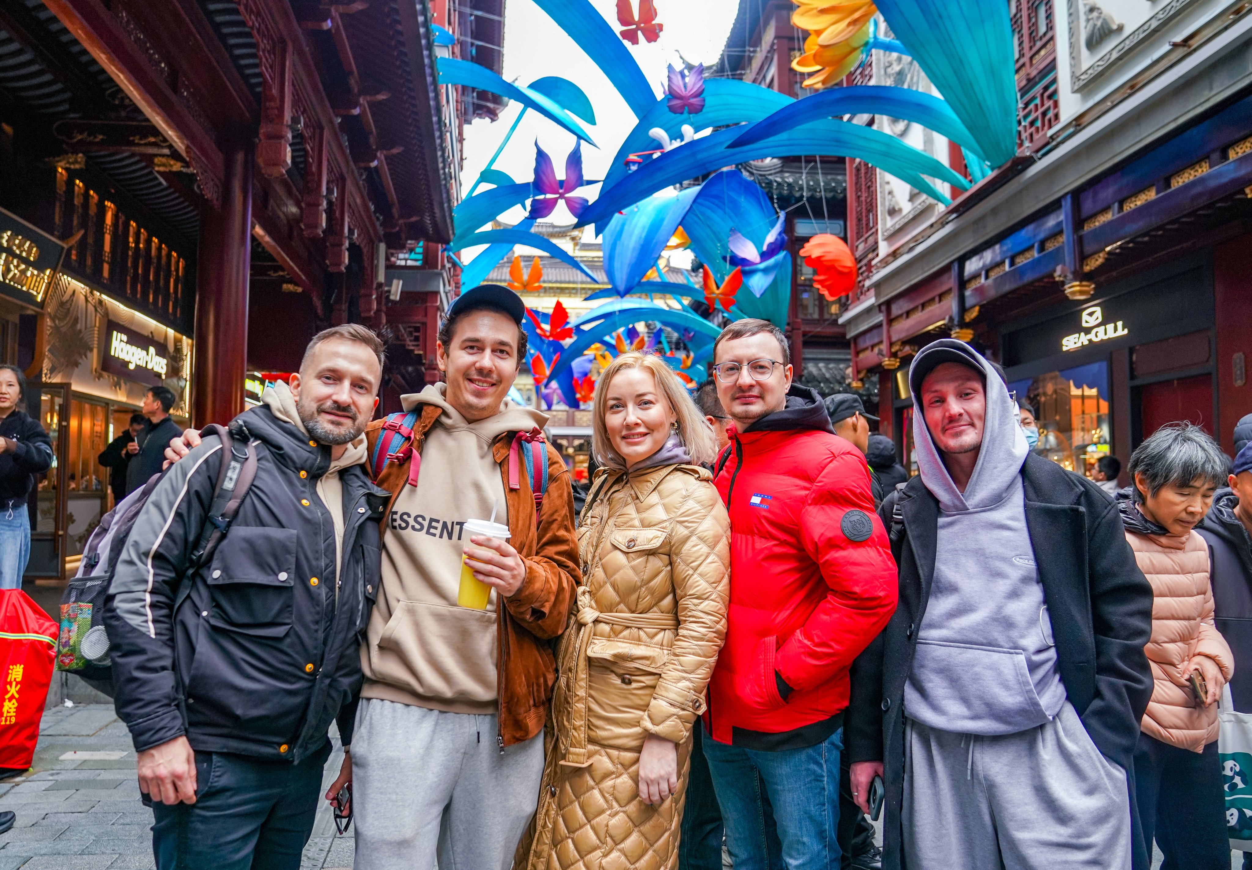 Tourists from Belarus and Russia pose for a photo in Shanghai’s Yu Garden. China has seen an upsurge in tourism during the Lunar New Year holiday. Photo: Xinhua