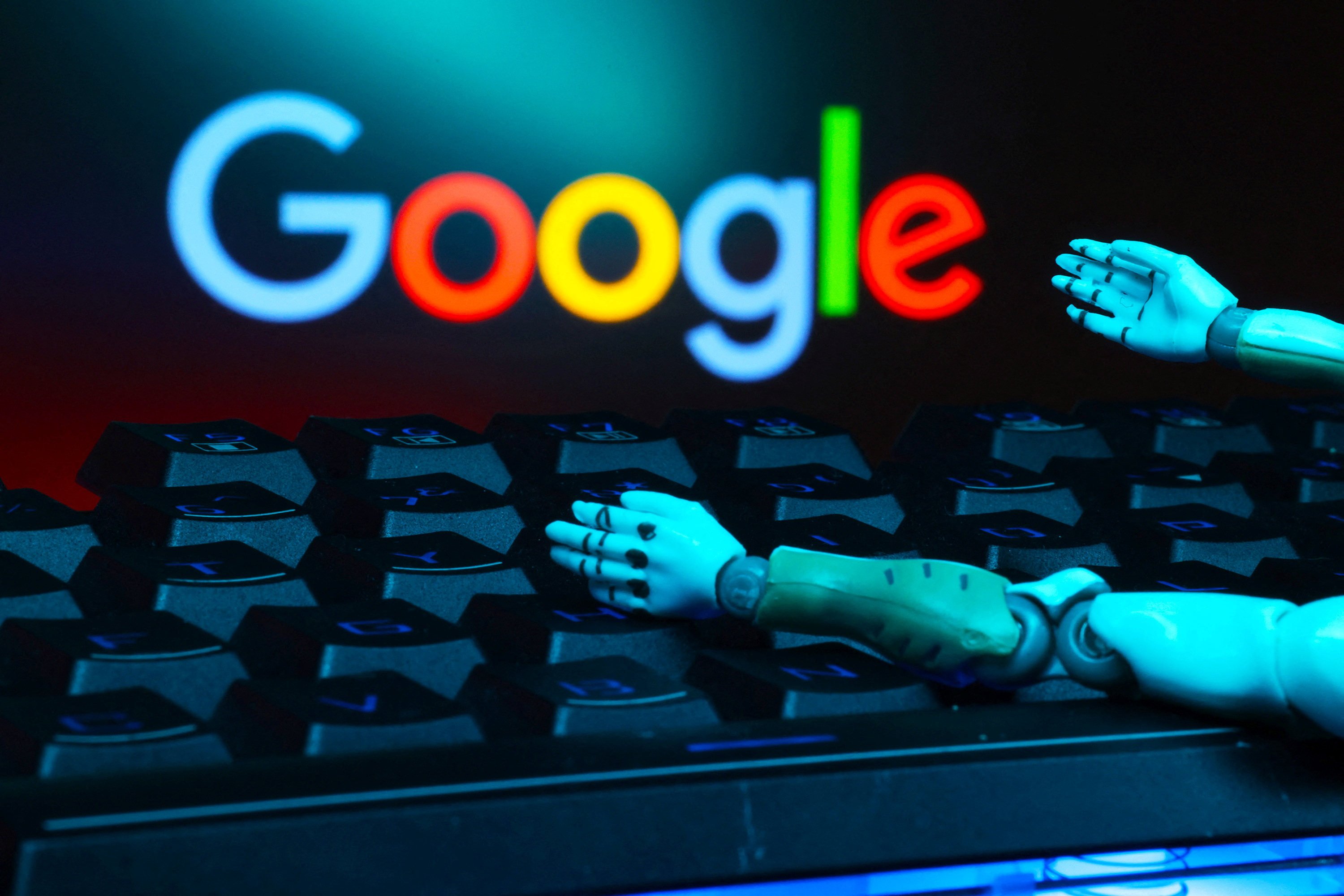 The Google logo, a keyboard, and robot hands are seen in this illustration taken January 27, 2025. Photo: Reuters