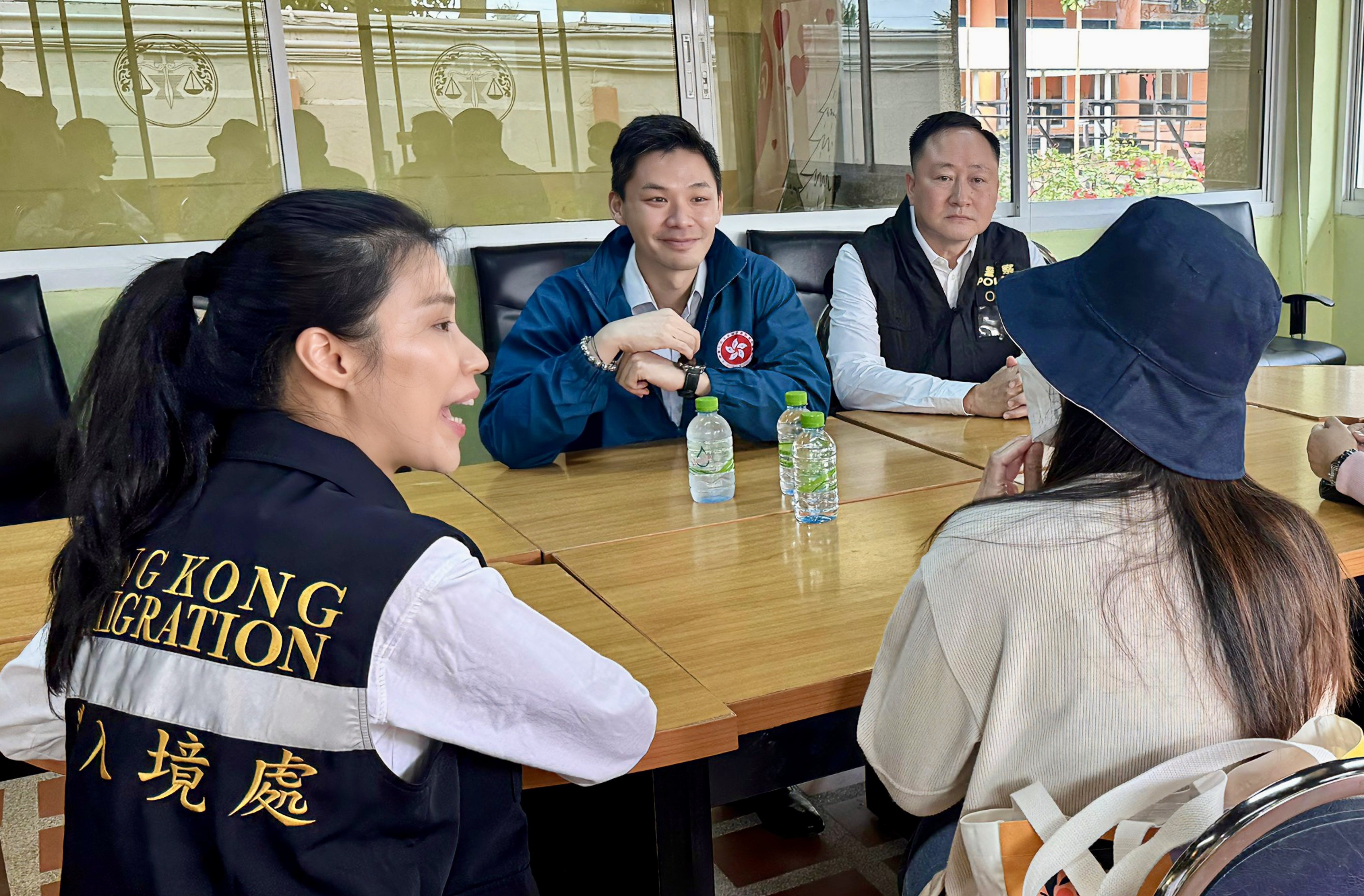 Hong Kong officials meet the victim (right) in Bangkok on Tuesday morning.  Photo: Handout