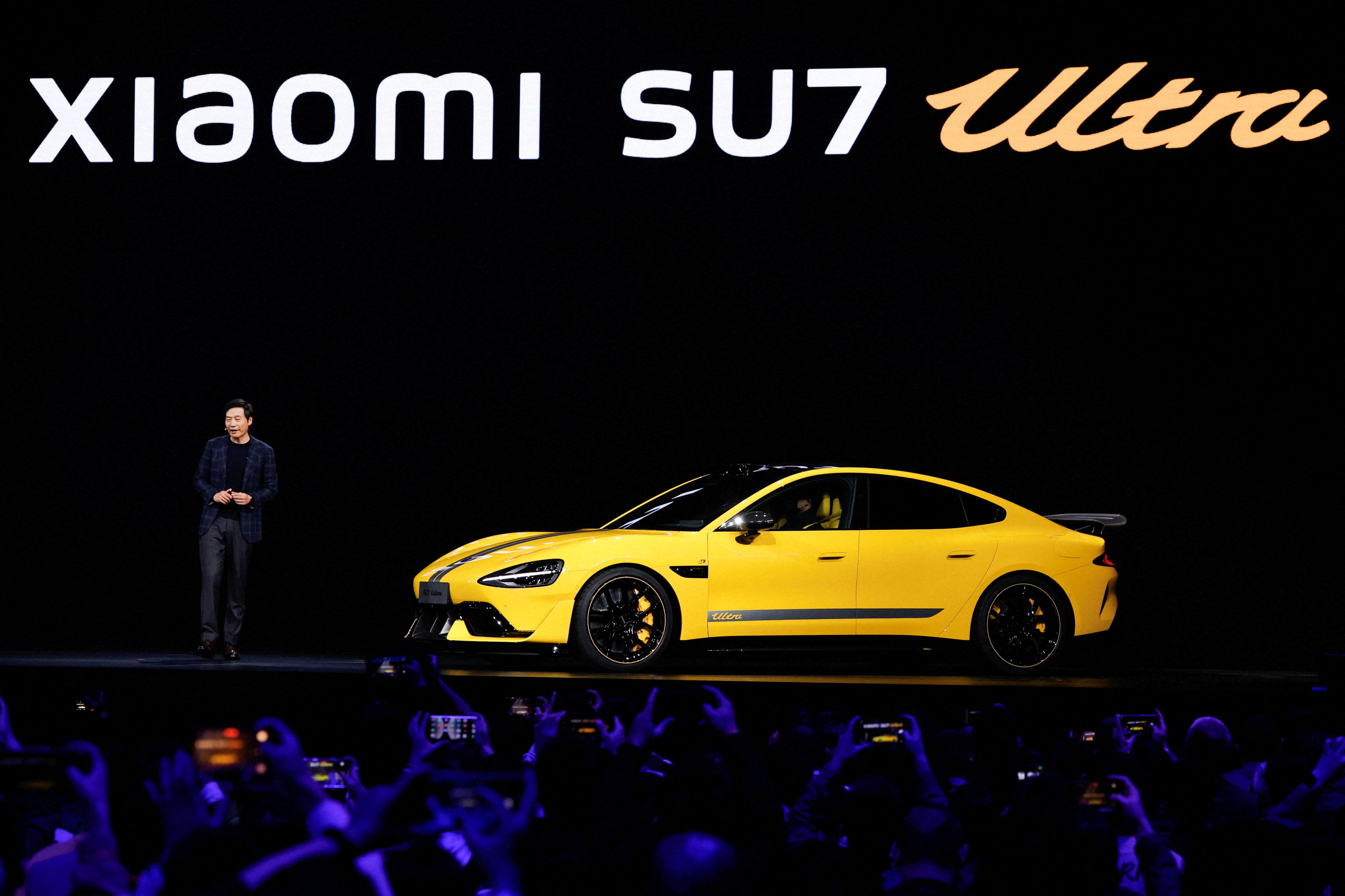 Xiaomi founder and CEO Lei Jun unveils the new SU7 Ultra sedan during an event in Beijing on October 29, 2024. Photo: Reuters