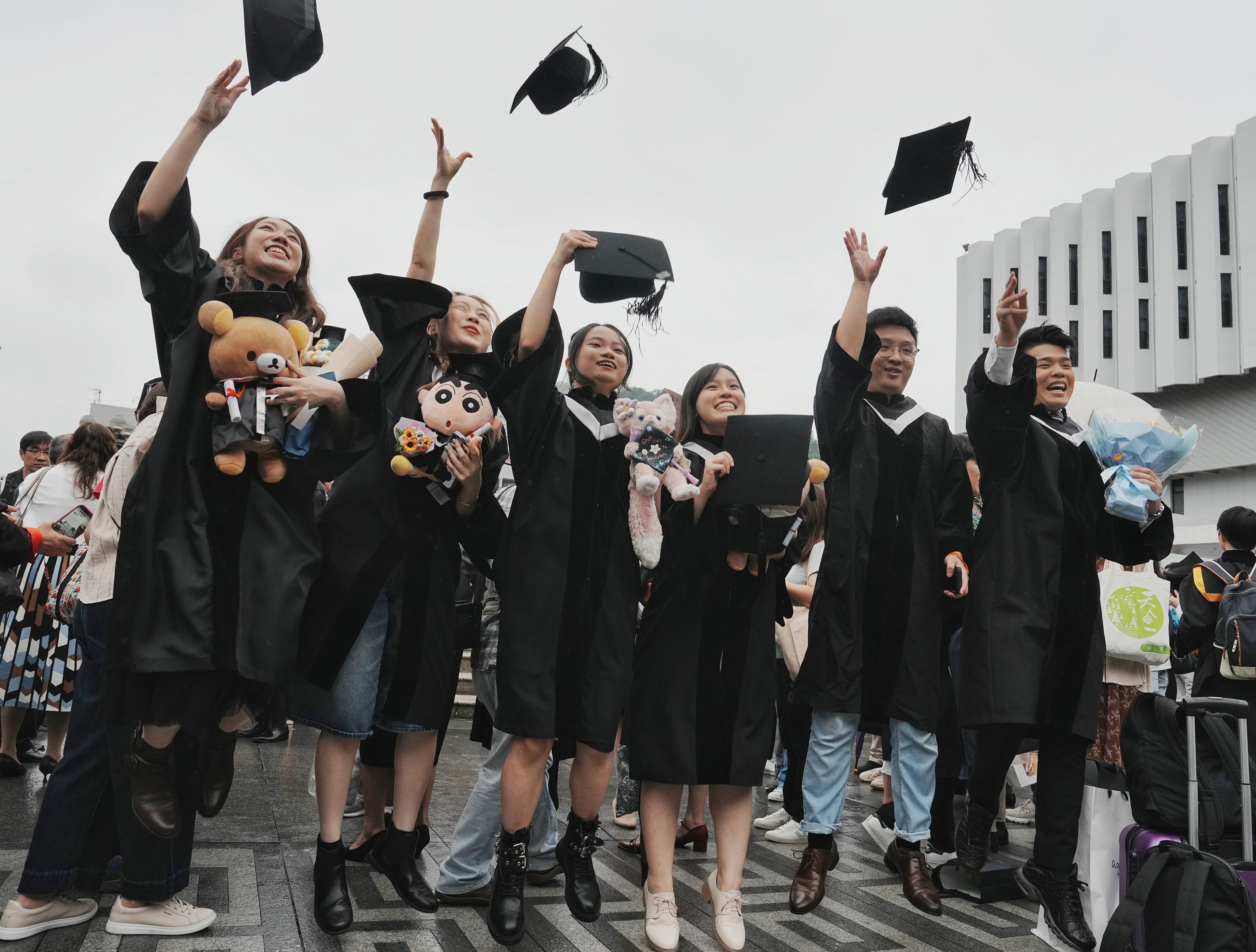 Chinese University of Hong Kong graduates celebrate on campus. Photo: Elson Li