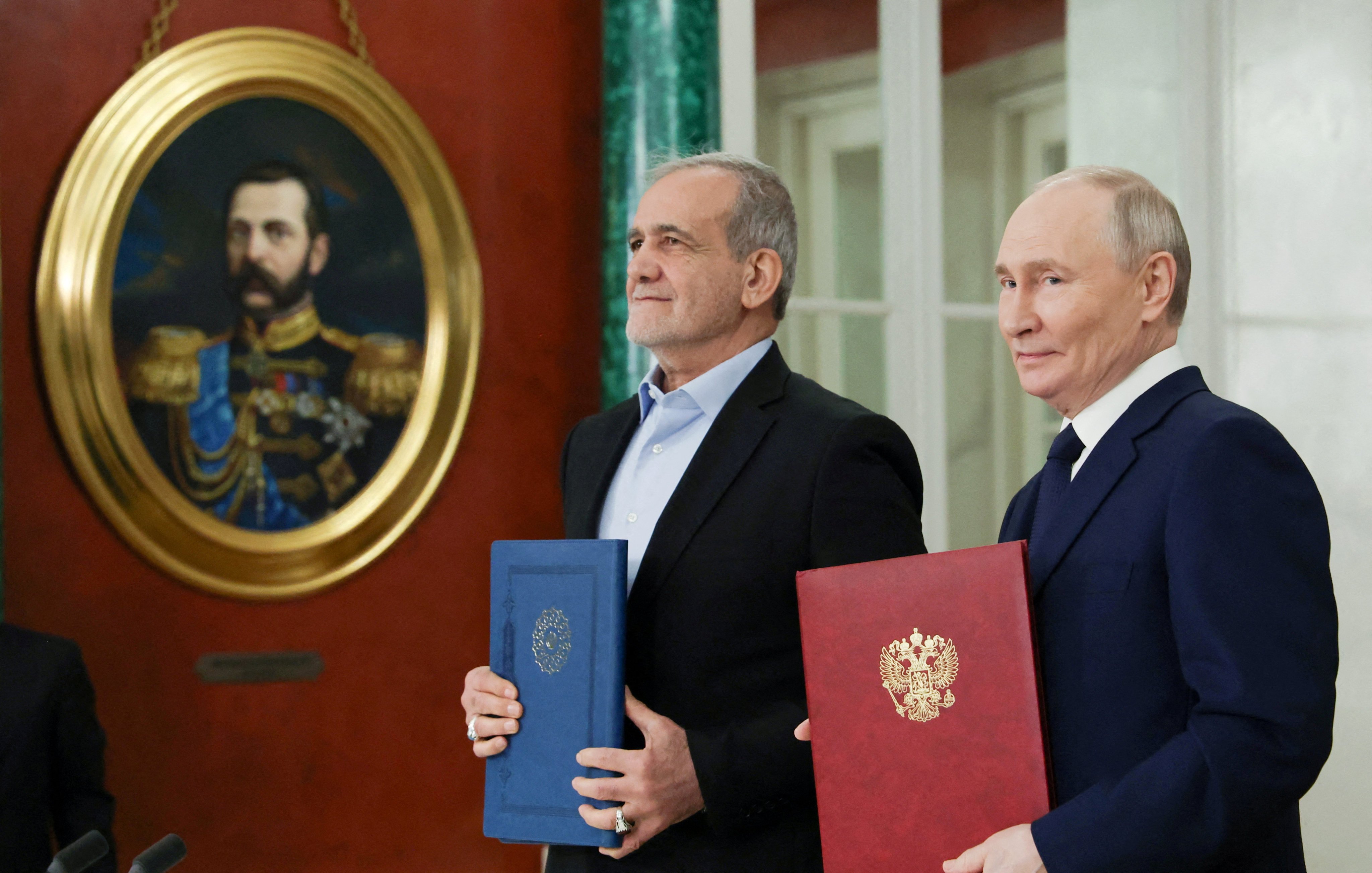 Russian President Vladimir Putin and Iranian President Masoud Pezeshkian attend a ceremony to sign an agreement of comprehensive strategic partnership between the two countries, at the Kremlin in Moscow, Russia on January 17. Photo: Sputnik / Pool via Reuters 