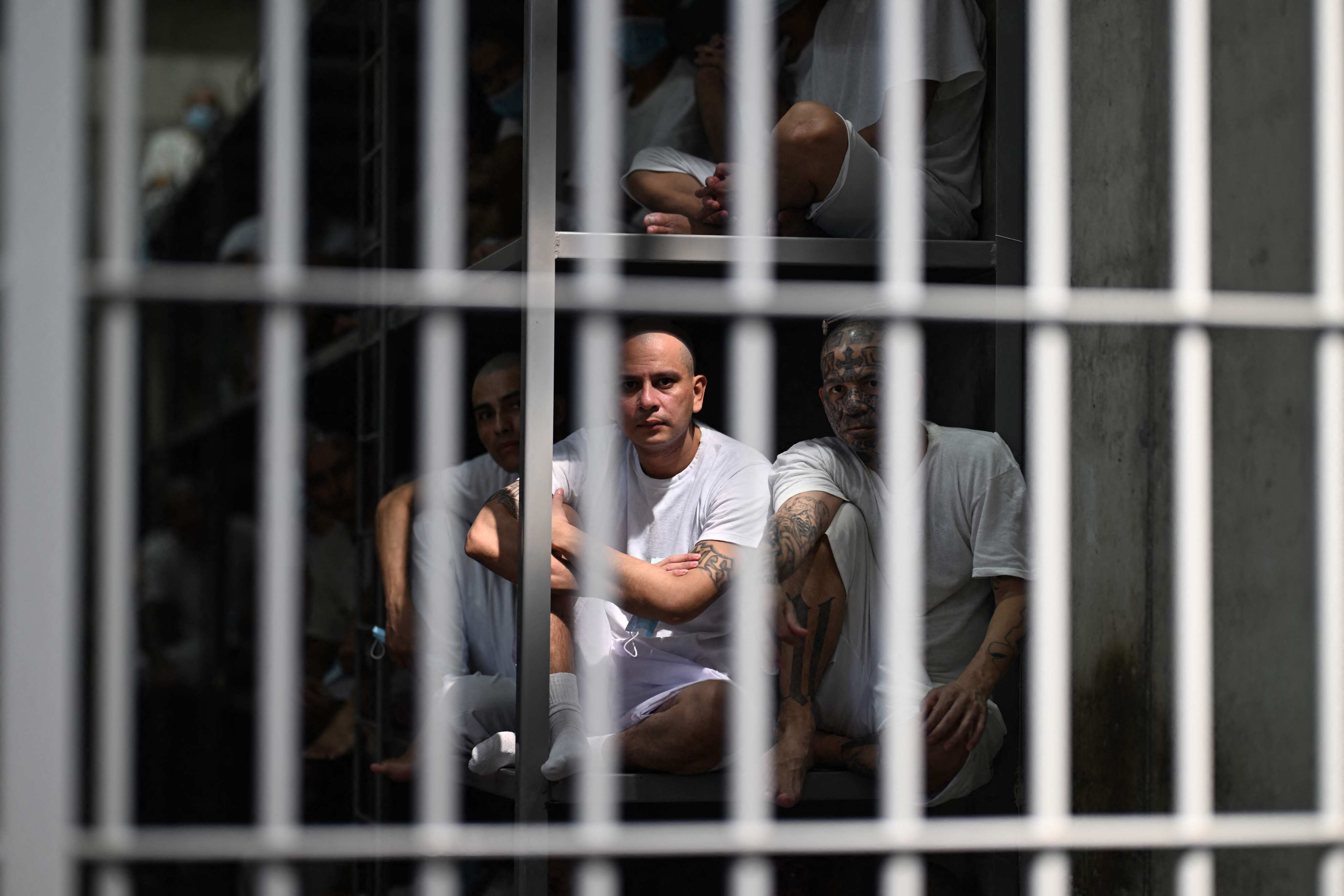 Inmates look out form a cell at the Counter-Terrorism Confinement Centre mega-prison in El Salvador last month. Photo: AFP