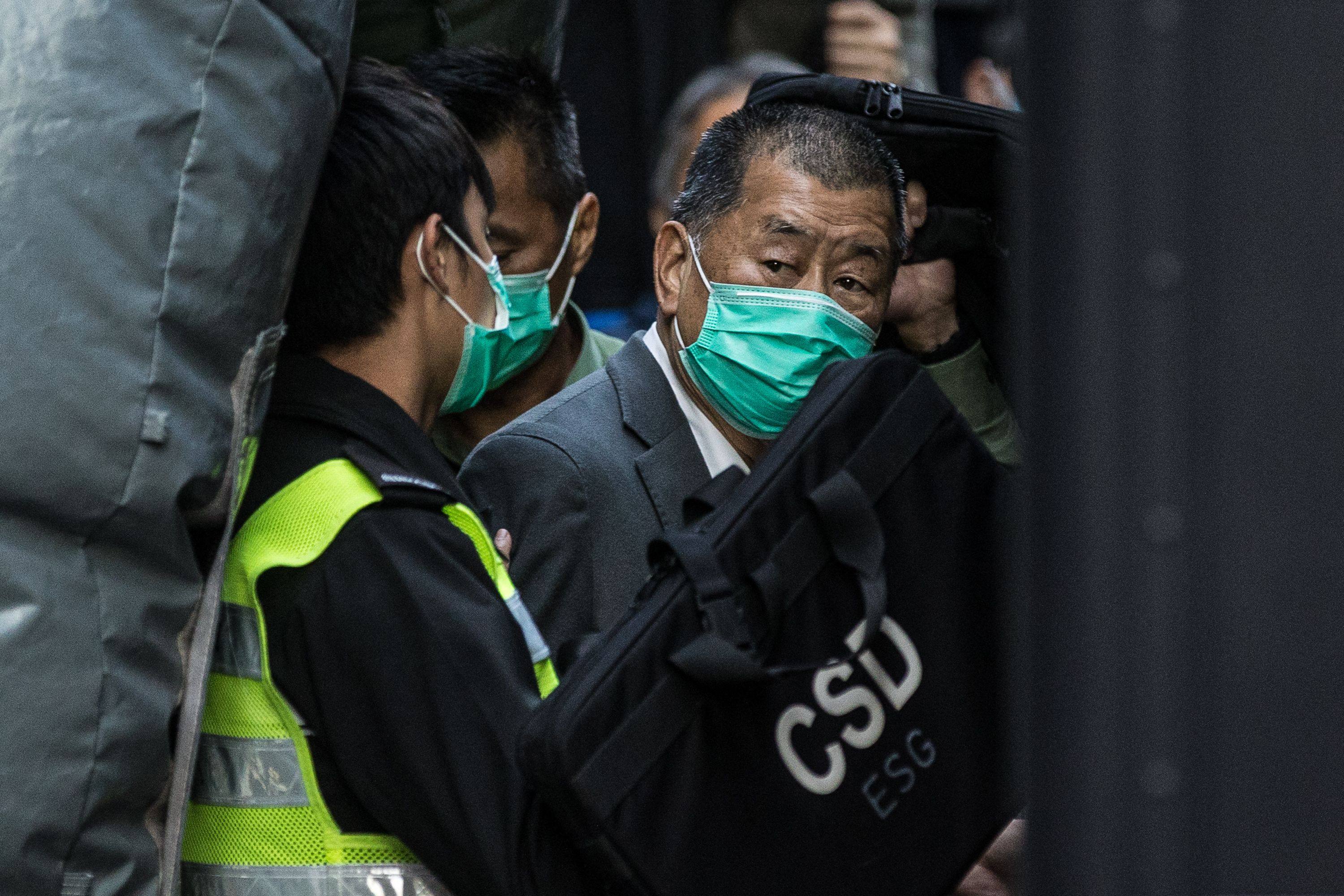 Jimmy Lai being escorted into a Hong Kong Correctional Services van in 2021. Photo: AFP