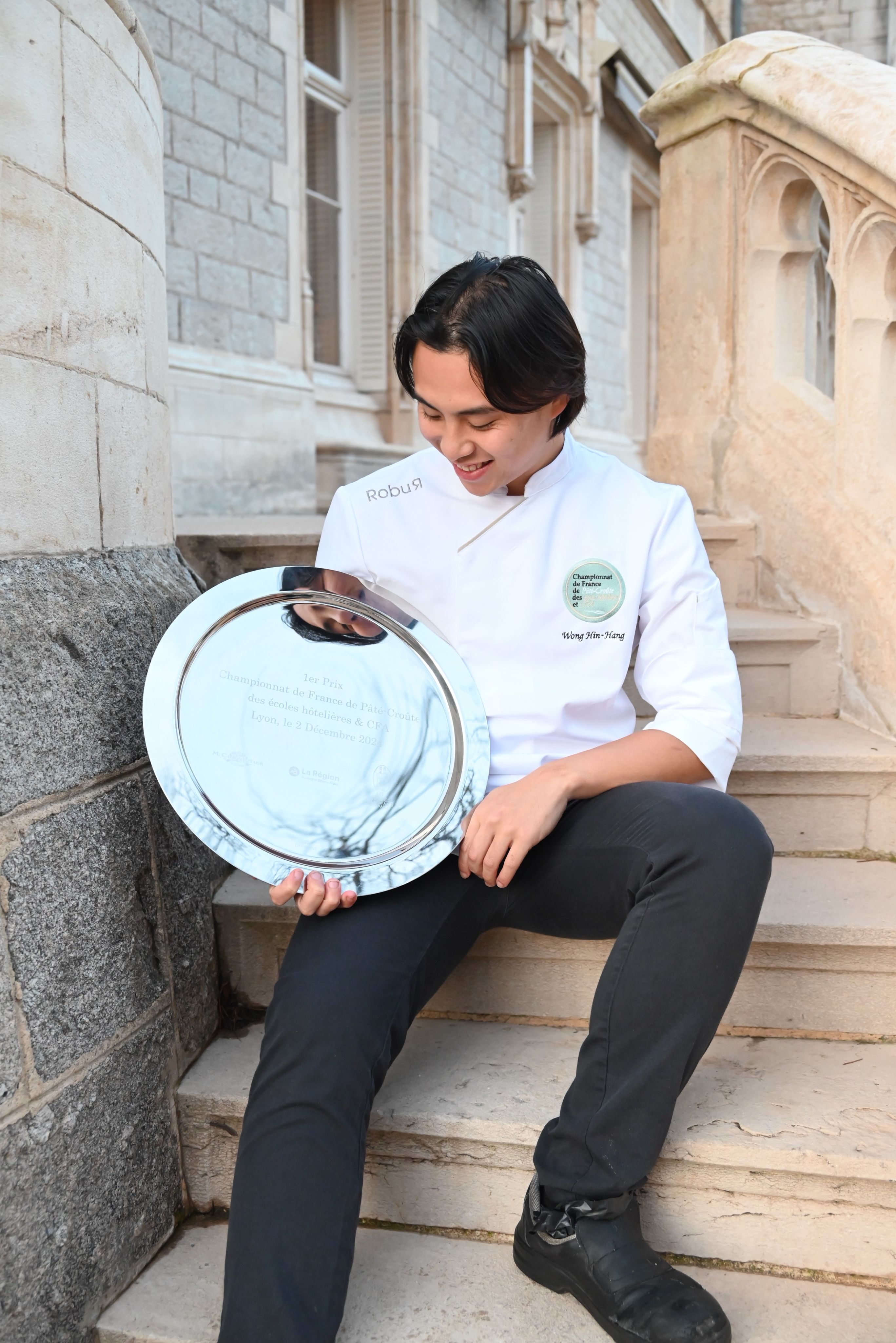 Hong Kong-born chef Jesse Summer Wong poses with the champion’s trophy plate after winning the Championnat de France de Pâté-Croûte des Écoles Hôtelières & CFA 2024 in Lyon in December. Photo: Courtesy of Jesse Summer Wong