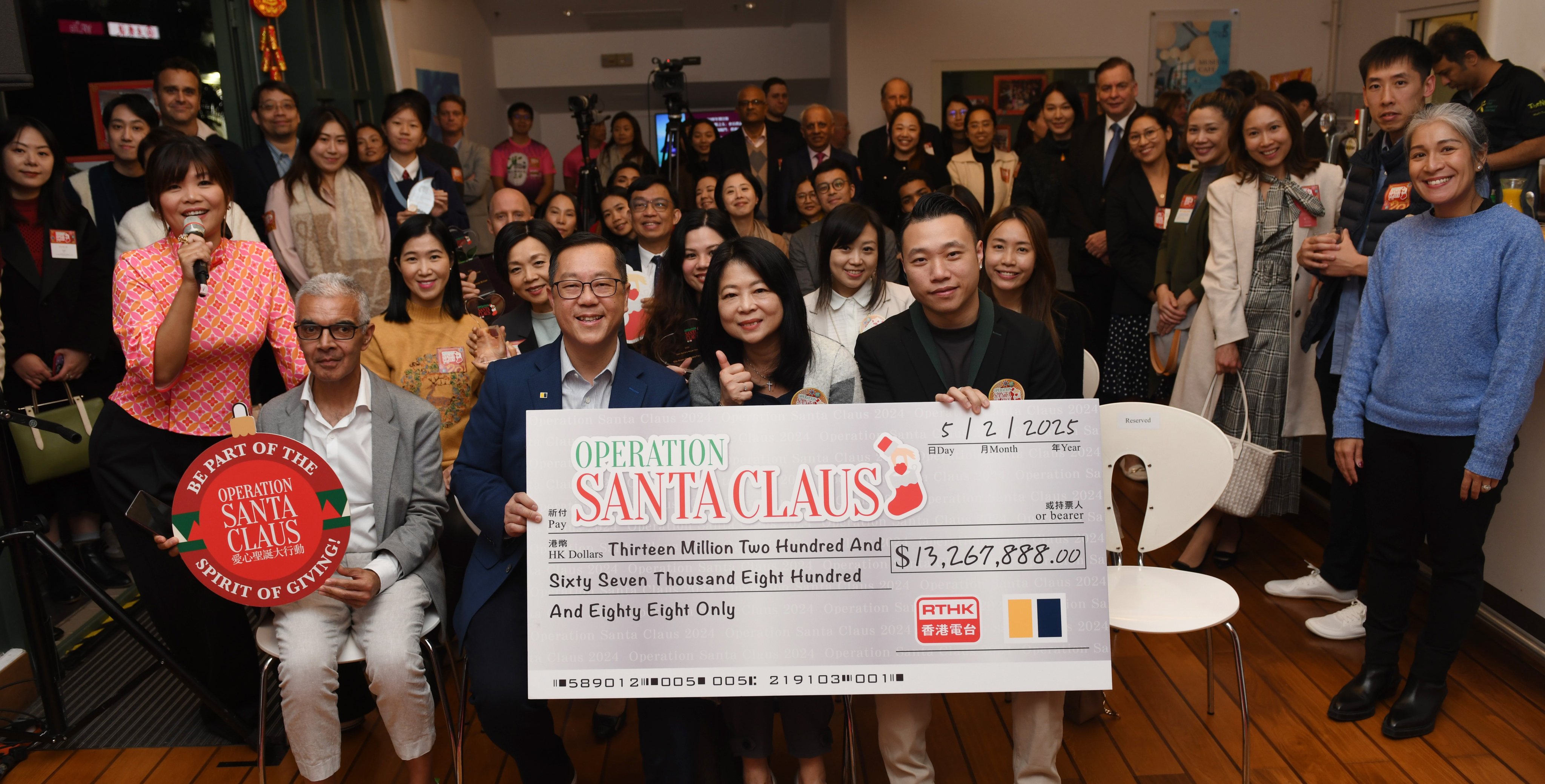 Kevin Huang (front row, second from left), the Post’s chief operating officer, and RTHK acting assistant director for radio Angel Cheng (front, second from right) with donors, beneficiaries and schools. Photo: SCMP