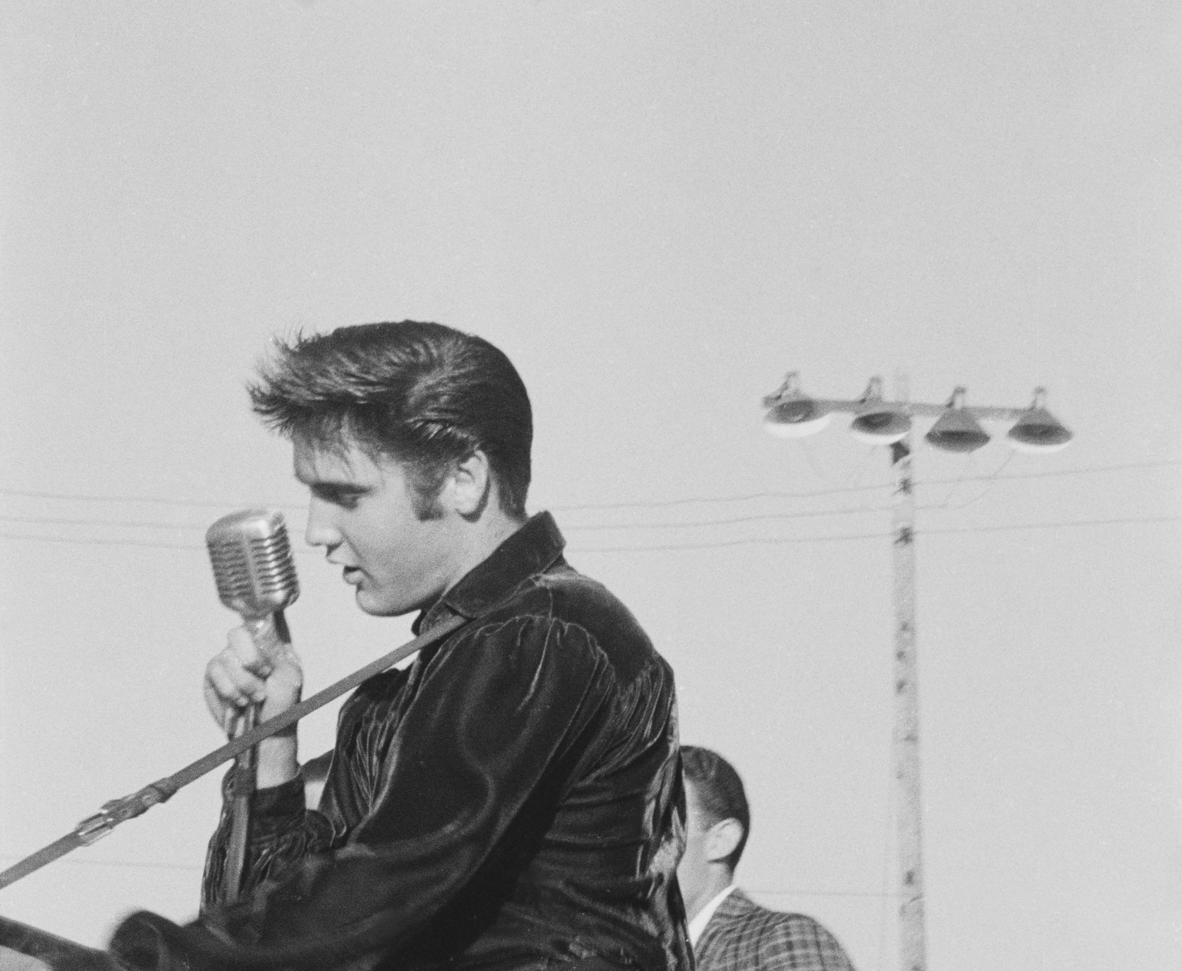 Elvis Presley, pictured on stage in Tupelo, Mississippi, in 1956, relied on the quality of the Shure Unidyne 55 microphone for performances so much that it became known as the Elvis Mic. Photo: Getty Images