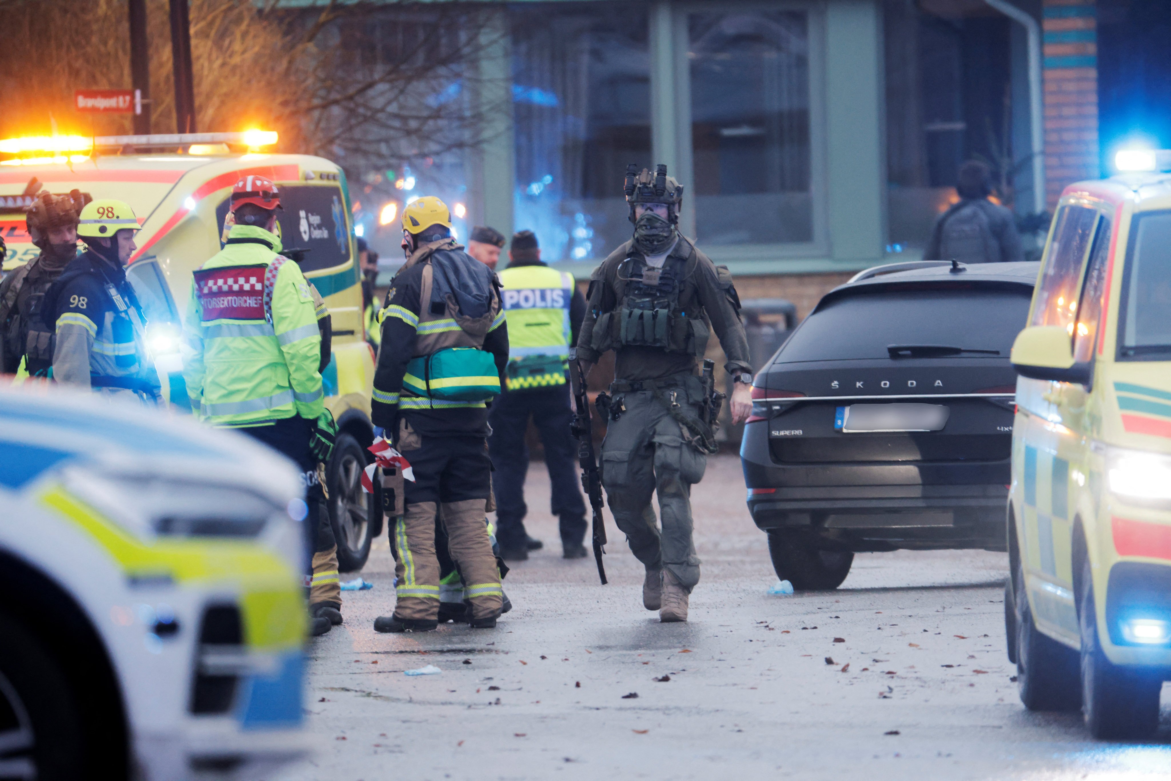 Emergency personnel and police officers work at Campus Risbergska after a shooting attack in Orebro, Sweden, on Tuesday. Photo: TT News Agency via Reuters