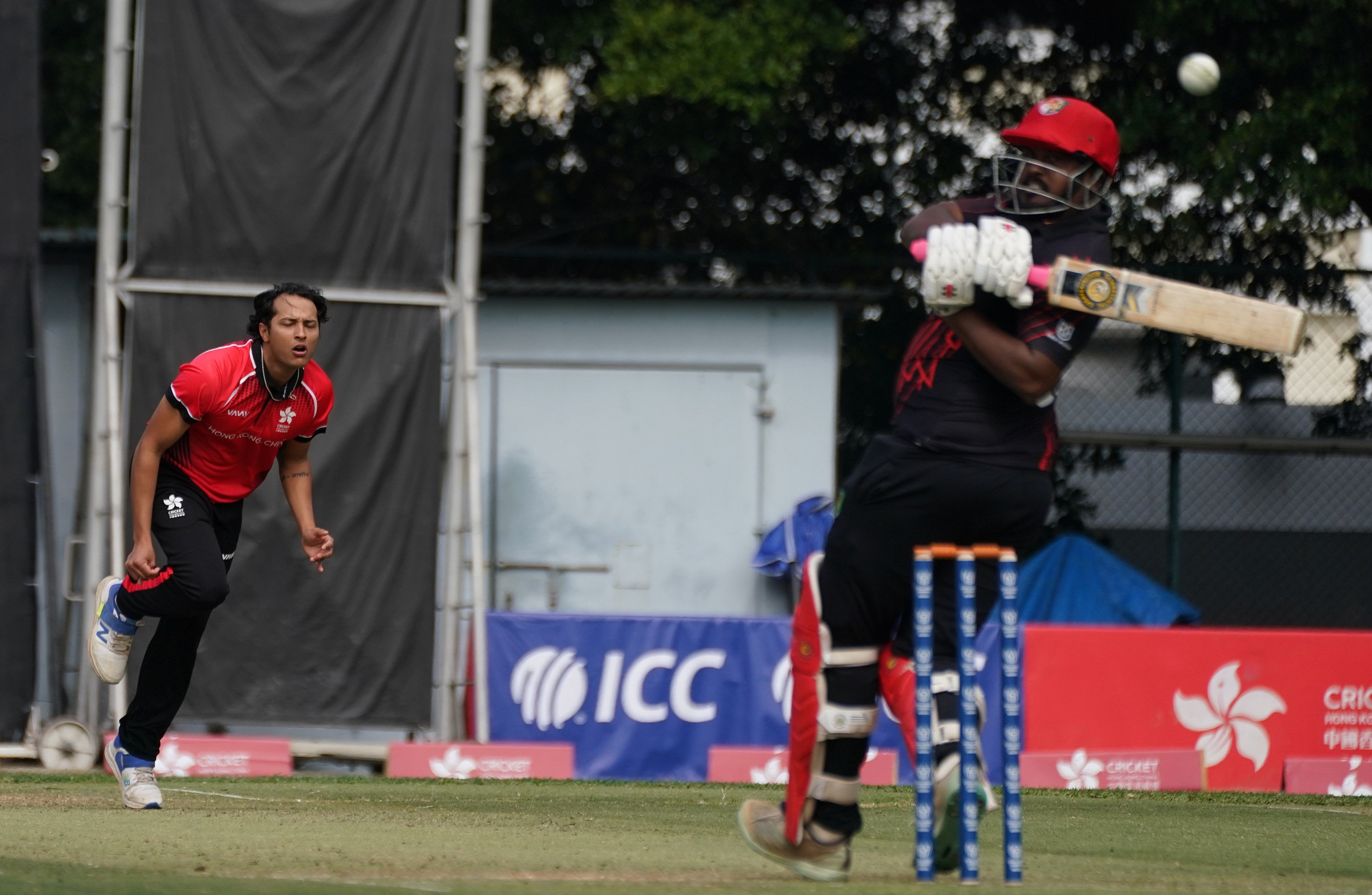 Ayush Shukla rushes a delivery past Thilipan Omaidurai during Singapore’s innings of 171. Photo:  Elson Li