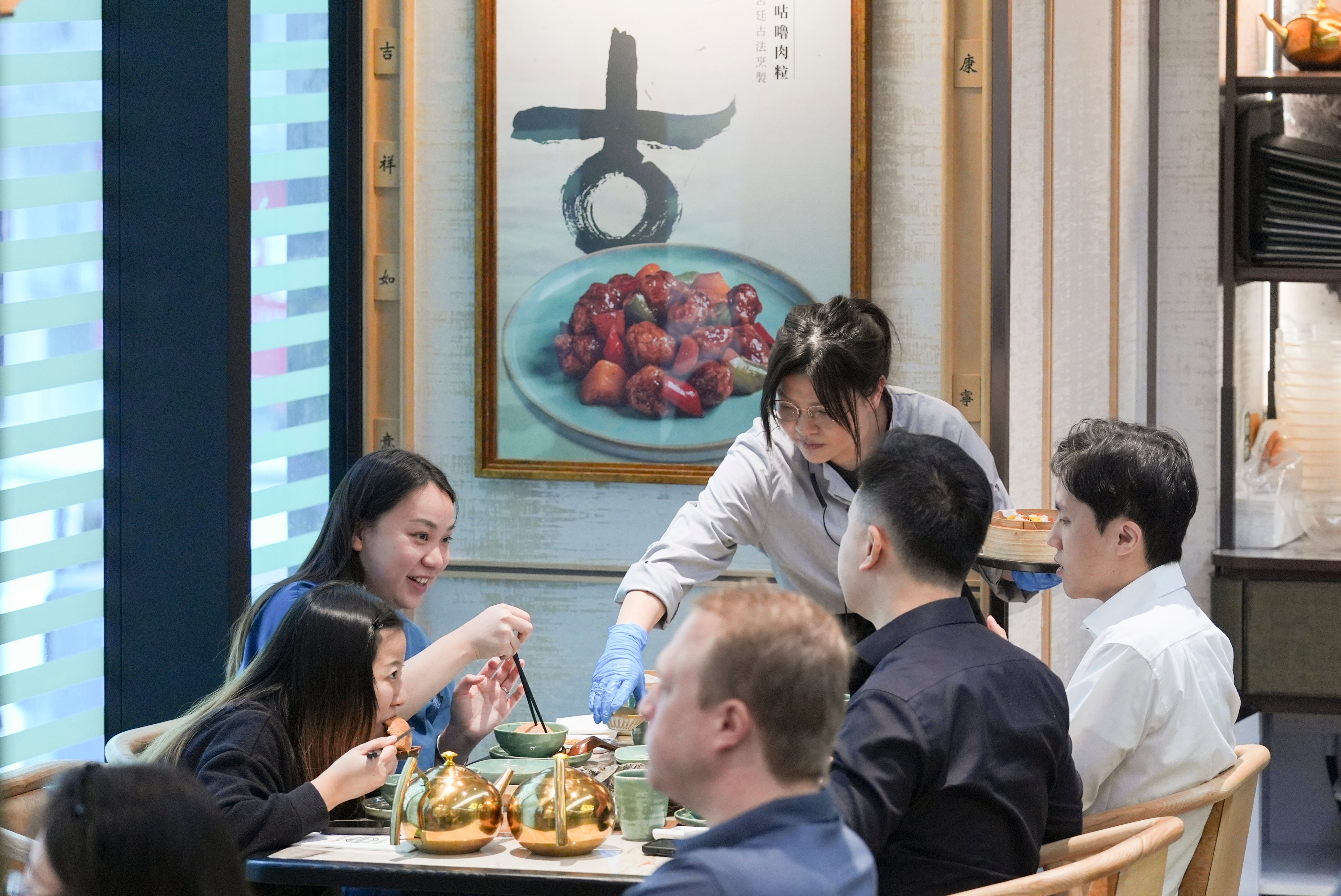 Diners at a restaurant in Tsim Sha Tsui. Provisional data released by the Census and Statistics Department showed the total value of restaurant receipts rose by 0.4 per cent year on year in the fourth quarter of 2024. Photo: Eugene Lee