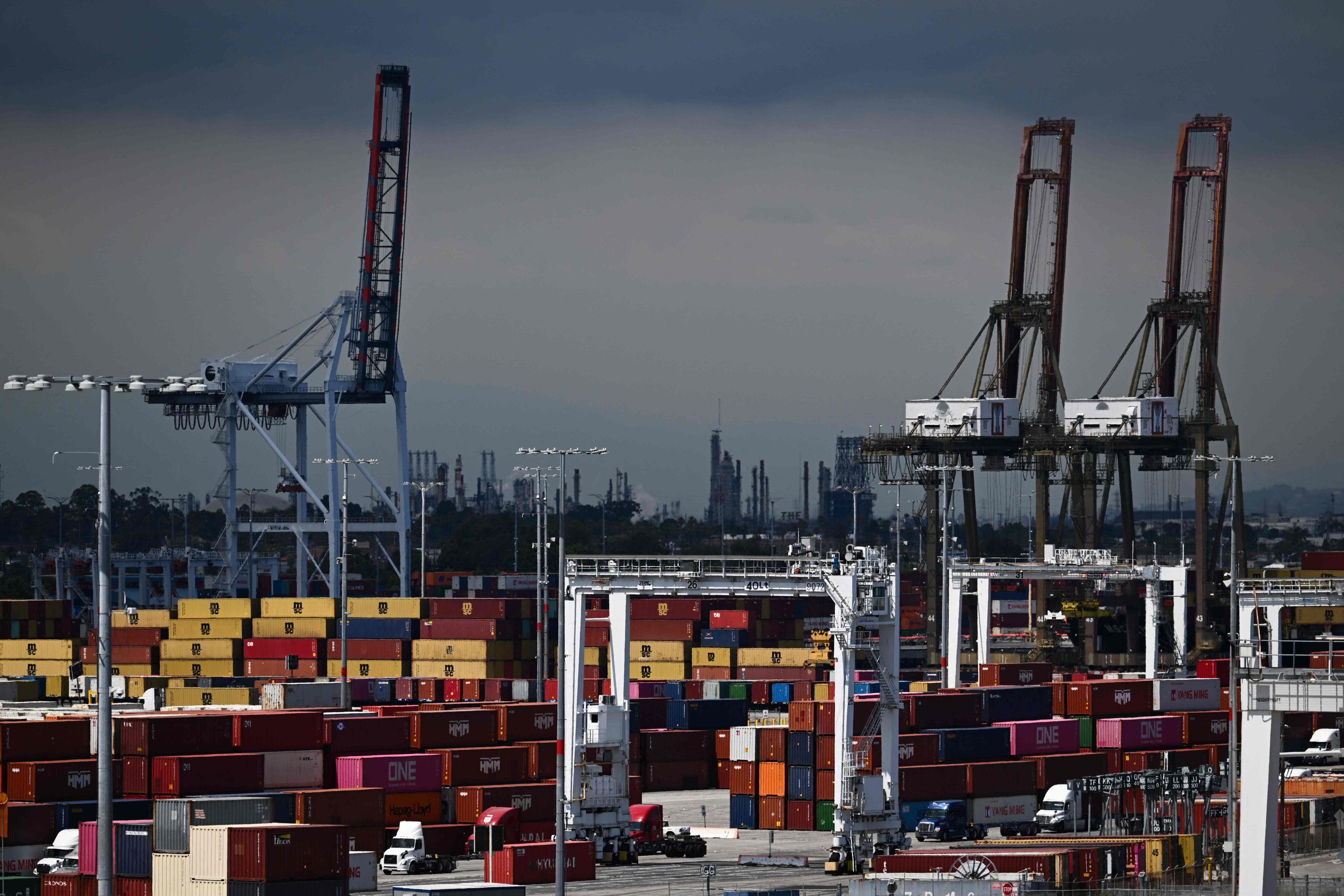 Trucks wait to be loaded with cargo shipping containers at the Port of Los Angeles. Photo: AFP 