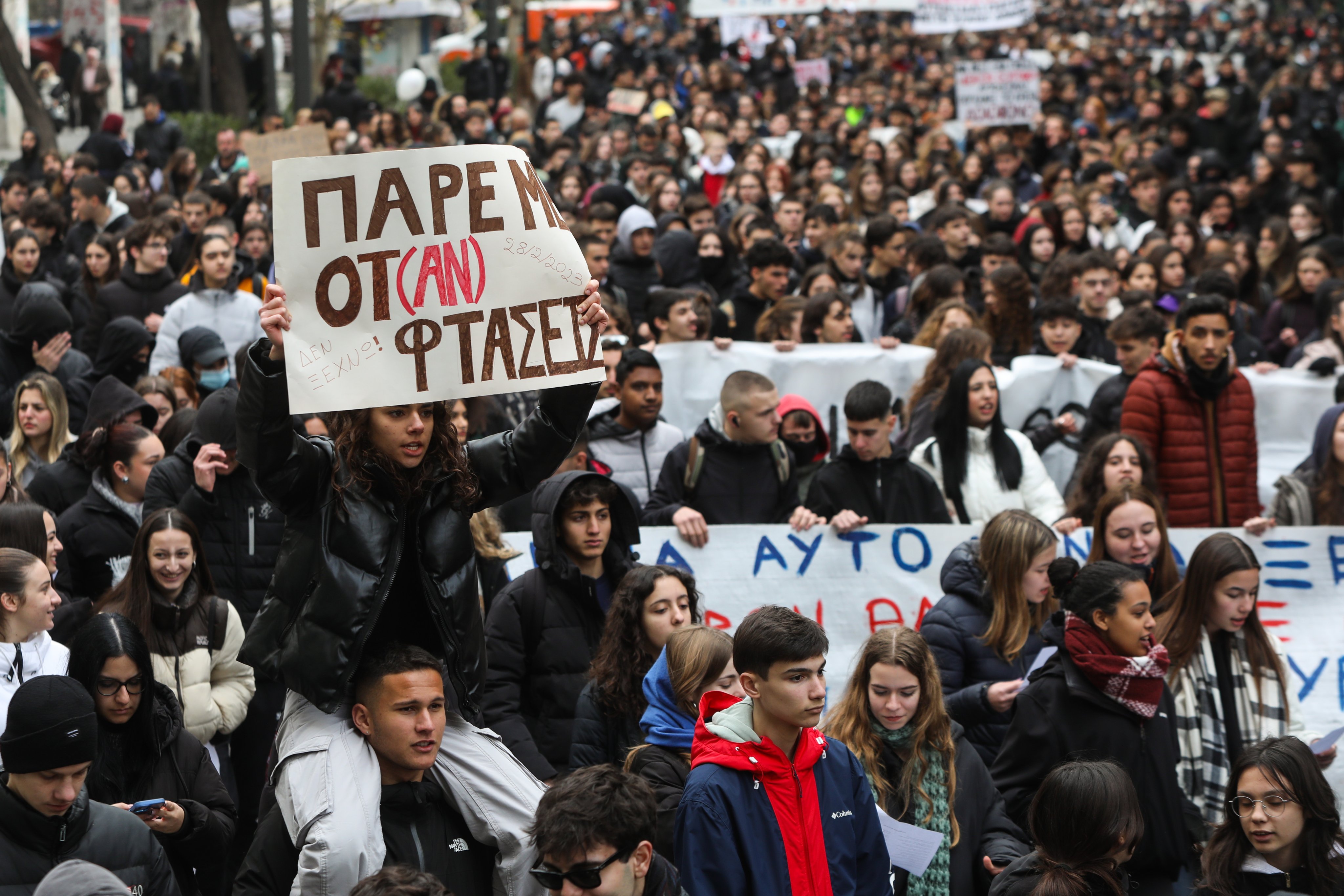 People shout slogans and hold placards during a protest rally in Greece on Friday, demanding justice for the 57 victims of a 2023 train crash. Photo: EPA-EFE