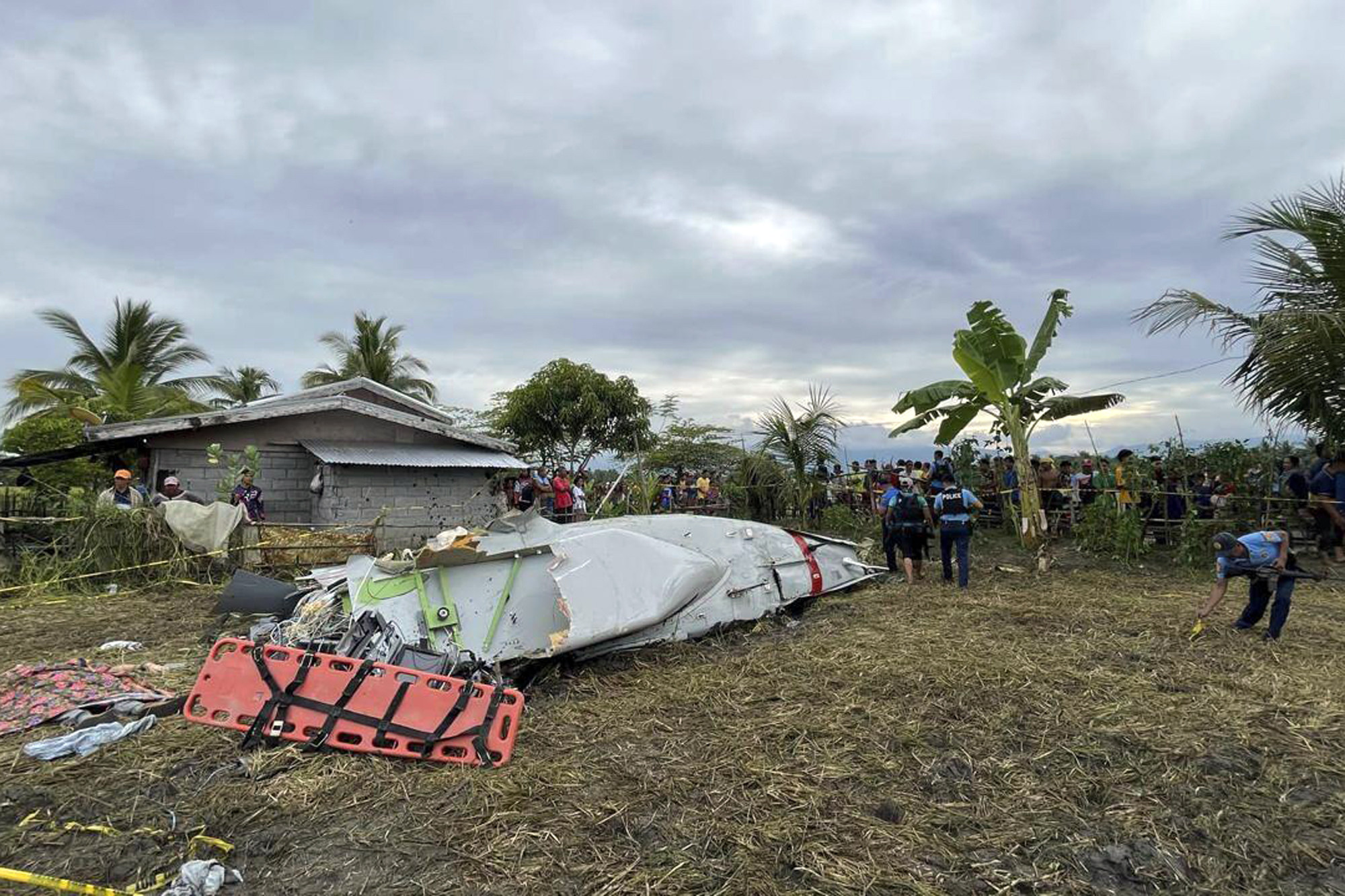 A US military-contracted plane crashed in a rice field in Maguindanao del Sur province, Philippines on Thursday, killing all four people on board. Photo: UGC via AP