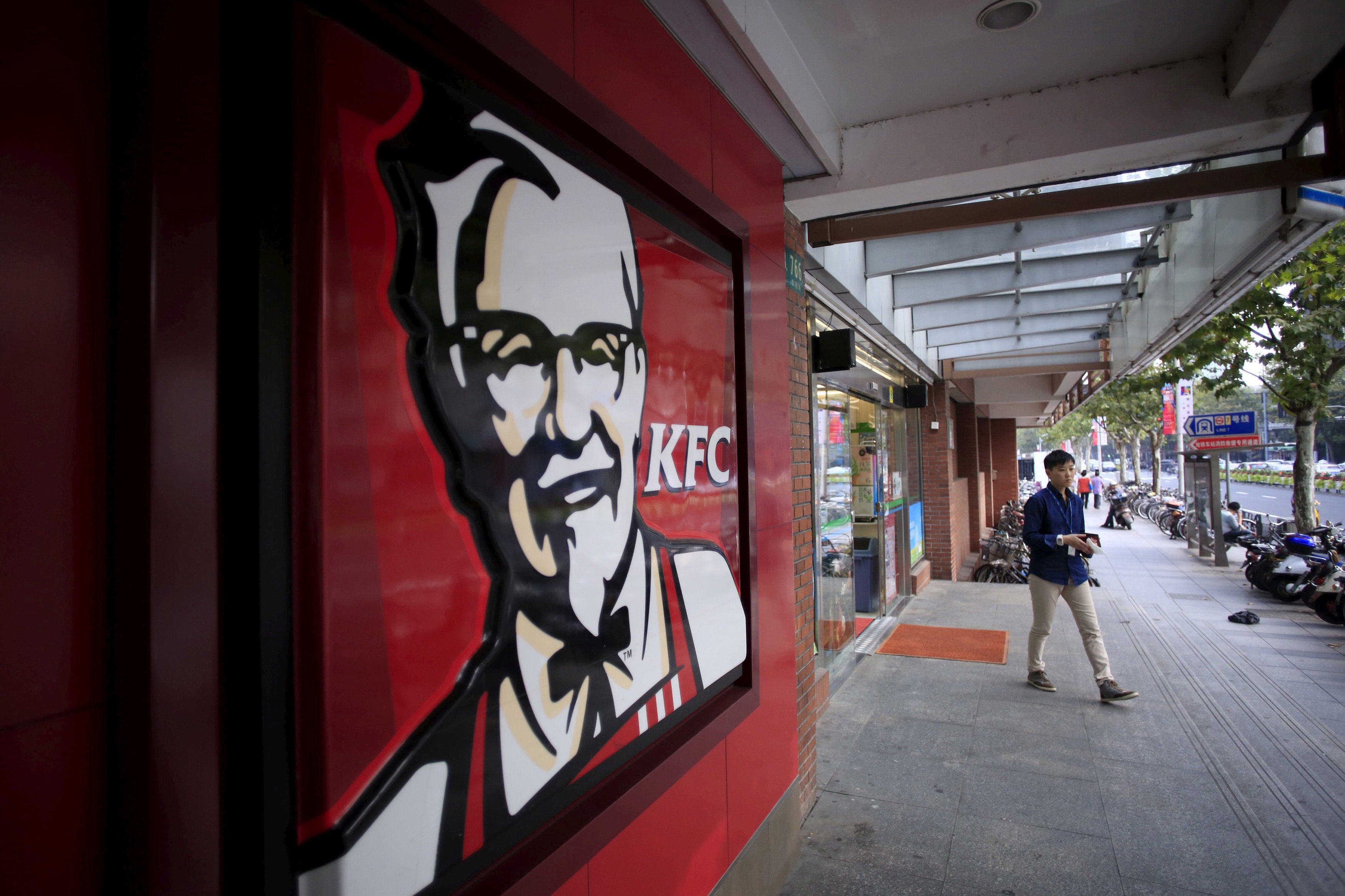 A customer leaves a KFC restaurant in Shanghai on October 9, 2015. Photo: Reuters