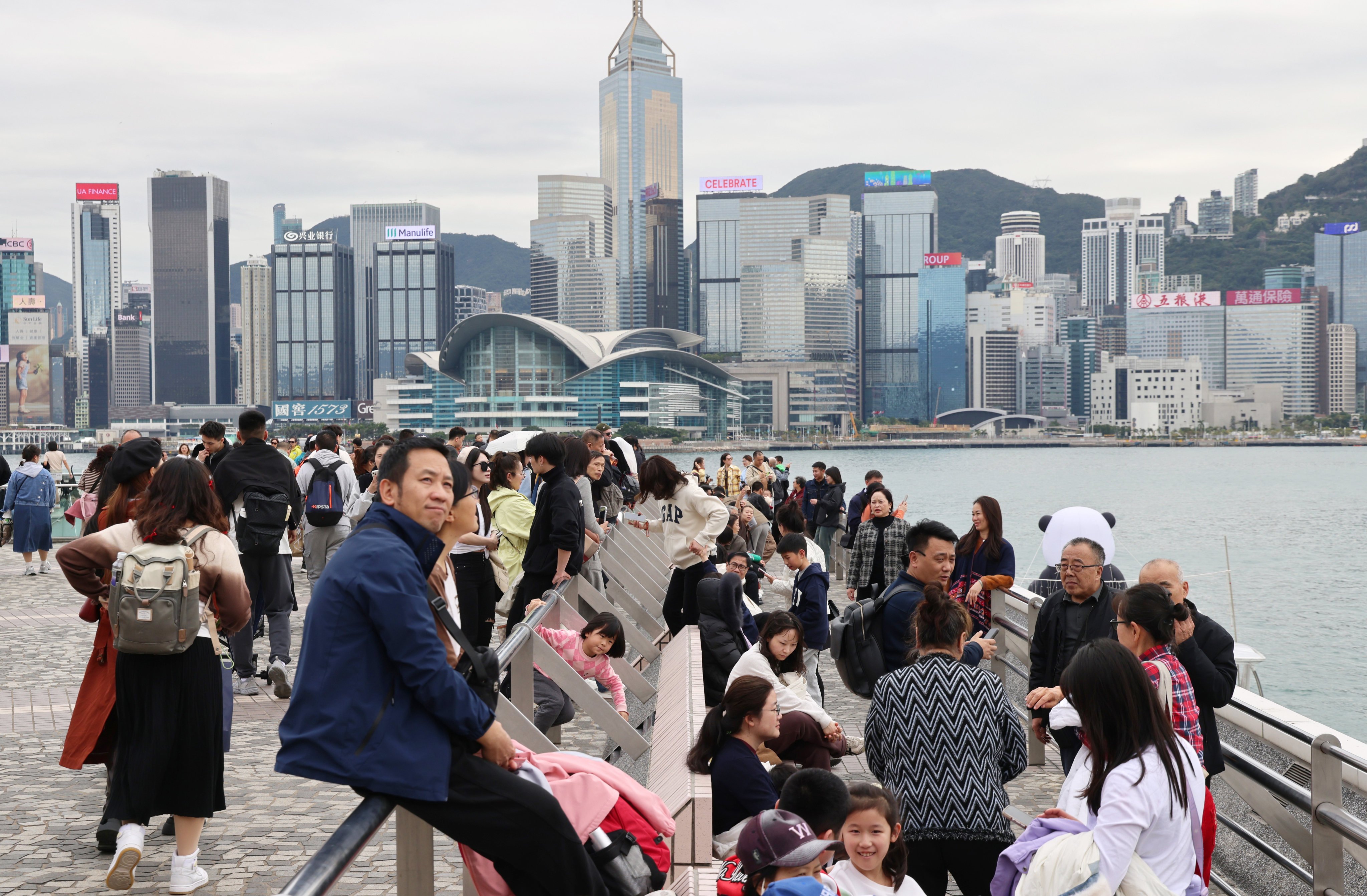 Tourists visit the Tsim Sha Tsui waterfront during Lunar New Year. Photo: Jelly Tse