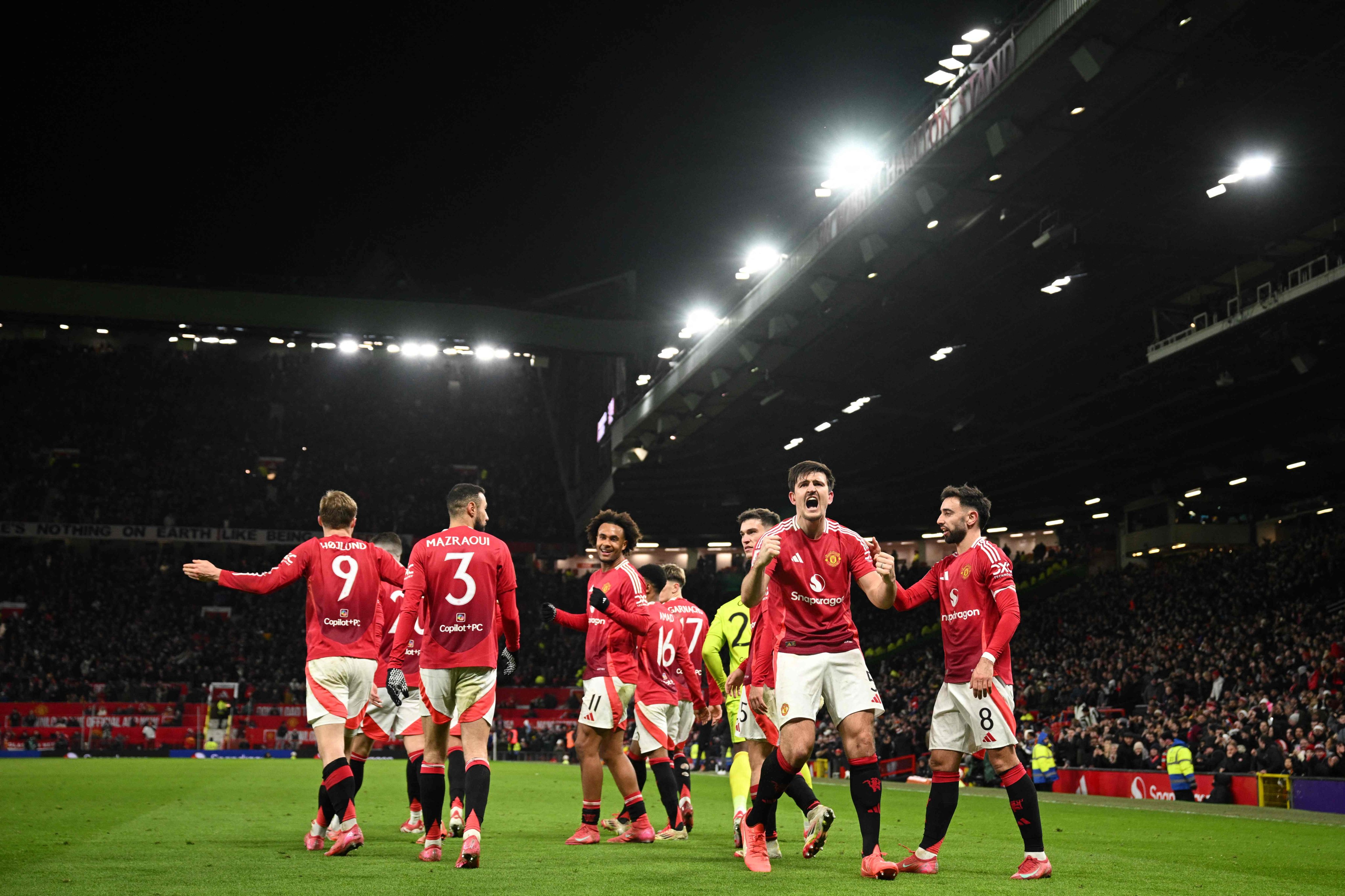 Manchester United players celebrate after Harry Maguire (second from left) scored a stoppage-time winner against Leicester City in the FA Cup. Photo: AFP