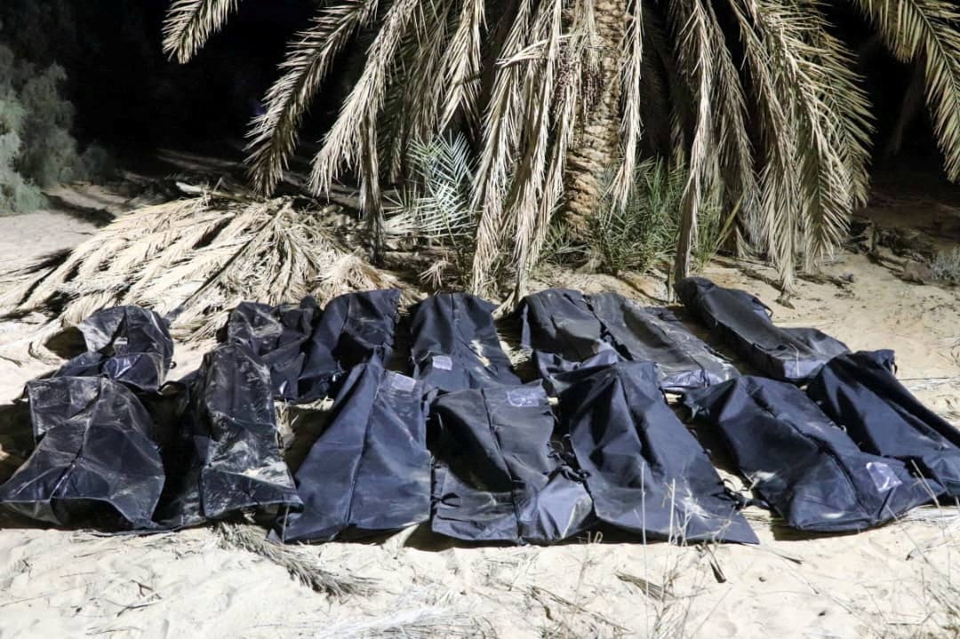 Bodies of migrants lie in bags, after they were discovered in a mass grave in a farm in Jikharra area, some 441 km from Benghazi, in Jikharra, Libya, on Wednesday. Photo: Reuters