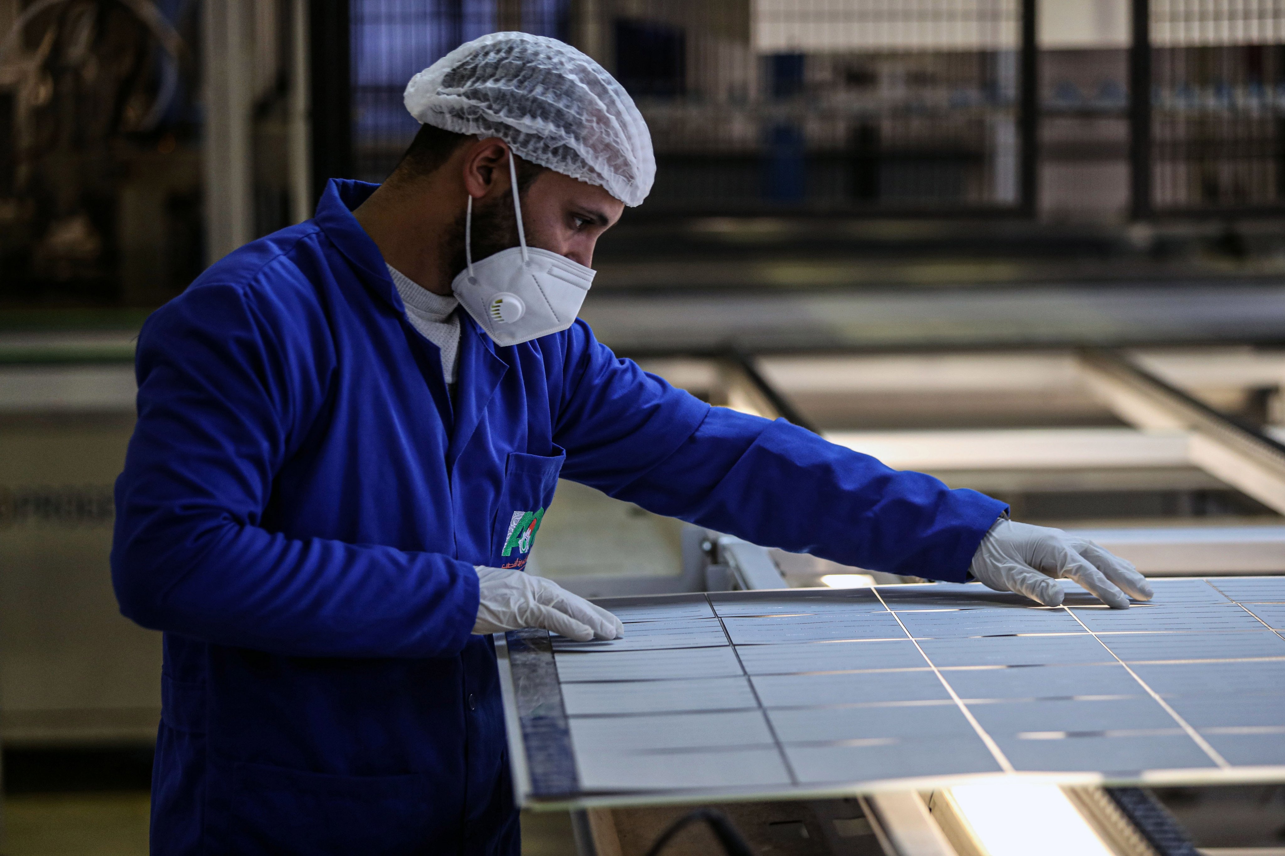 A man works at a solar panel factory in Cairo, Egypt, on February 1. Egyptian factories are partnering with Chinese companies to generate more renewable energy. Photo: Xinhua