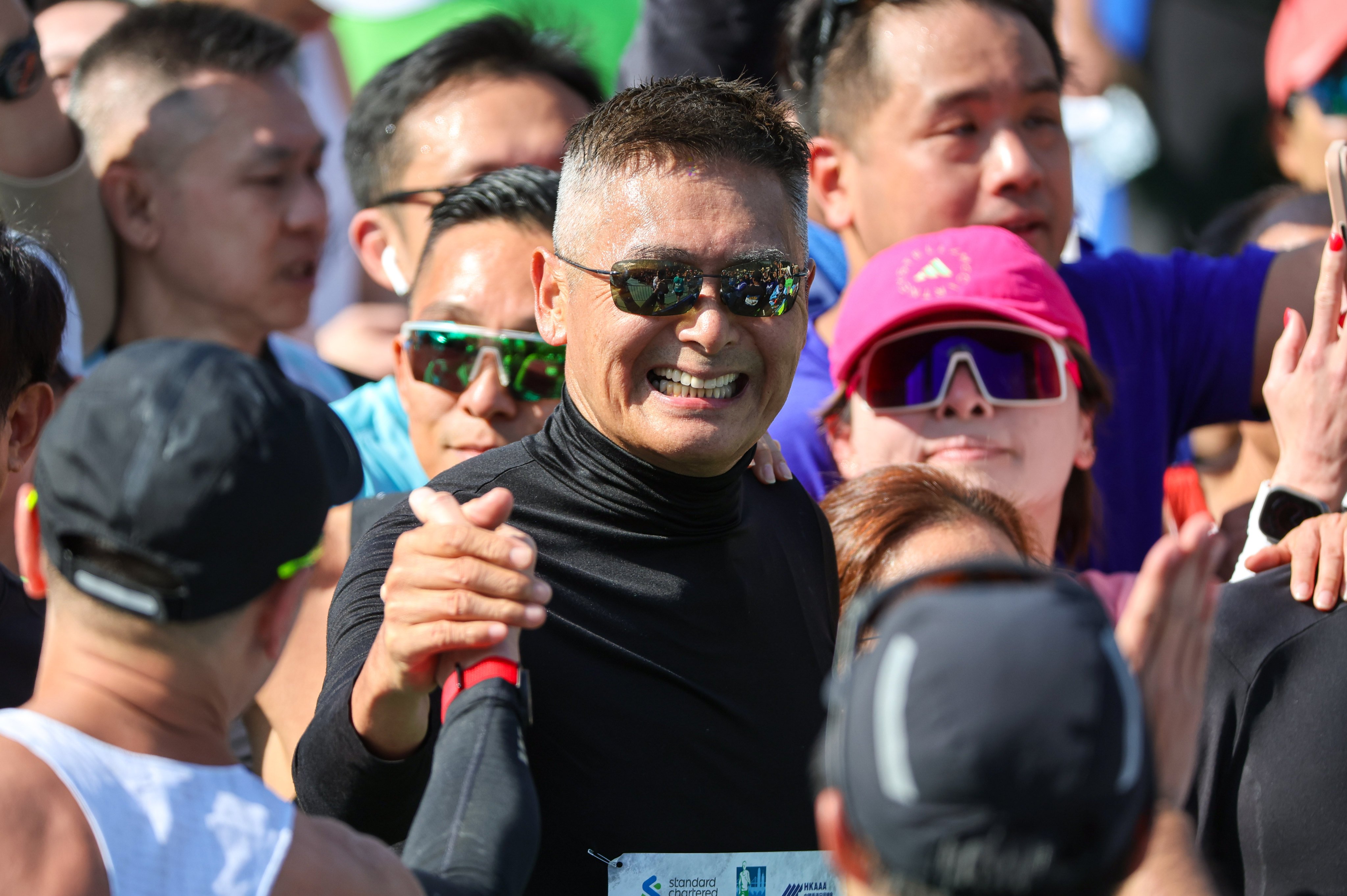 Chow Yun-fat at the Standard Chartered Hong Kong Marathon finish line. Photo: Edmond So