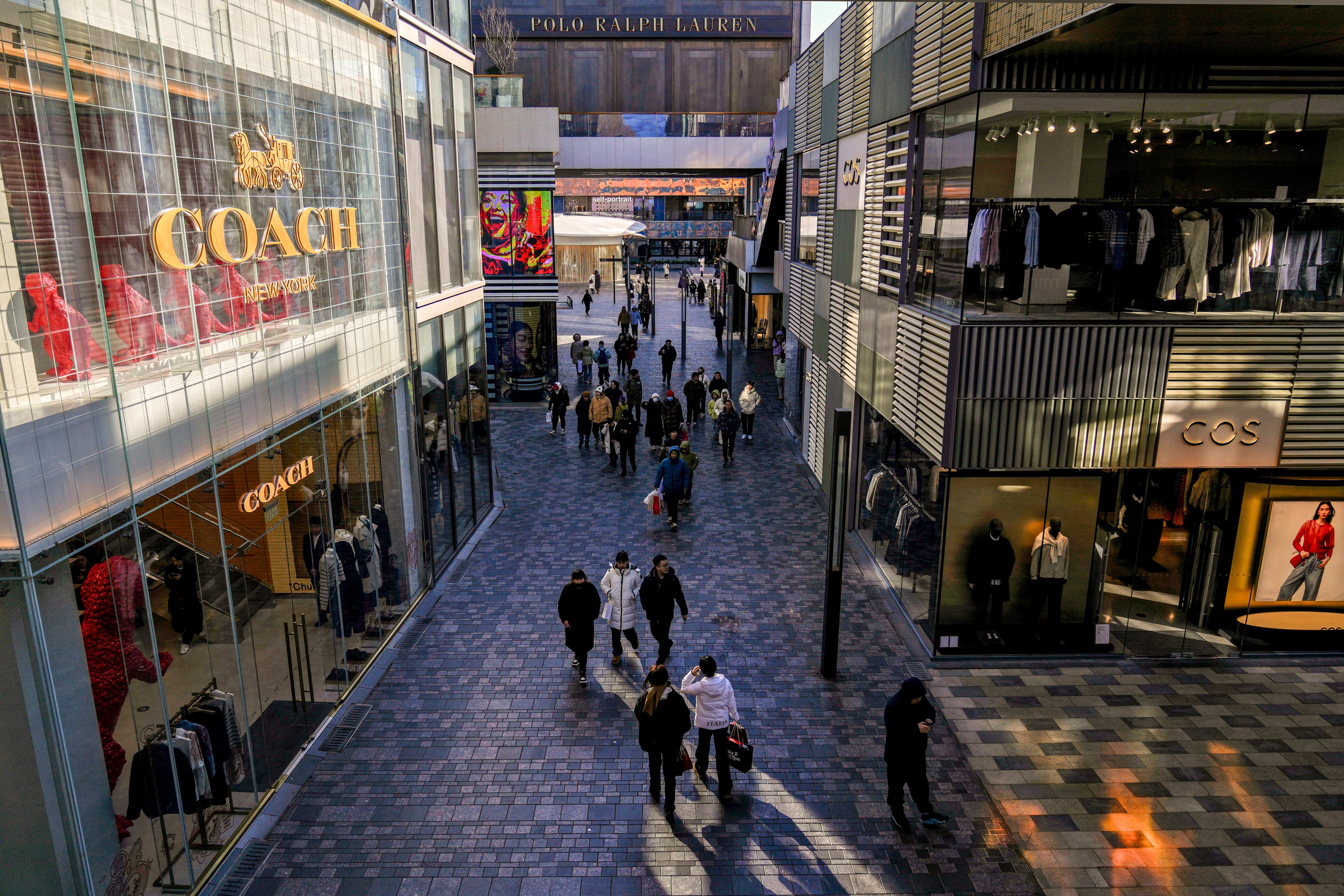 Shoppers in an outdoor mall in Beijing. Photo: AP