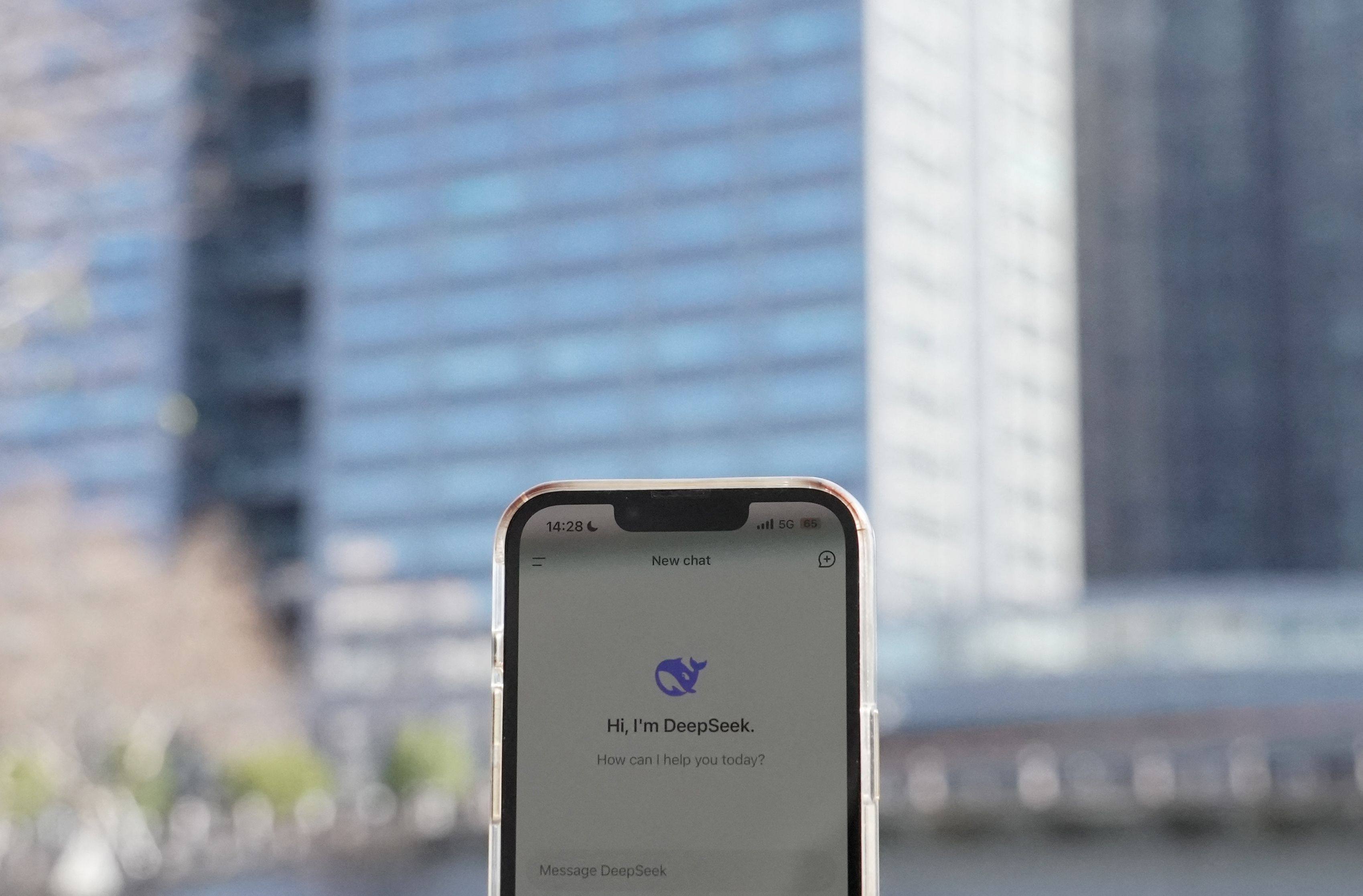 The DeepSeek app on a smartphone, seen in front of the building housing the headquarters of Chinese AI startup DeepSeek in Hangzhou. Photo: AFP