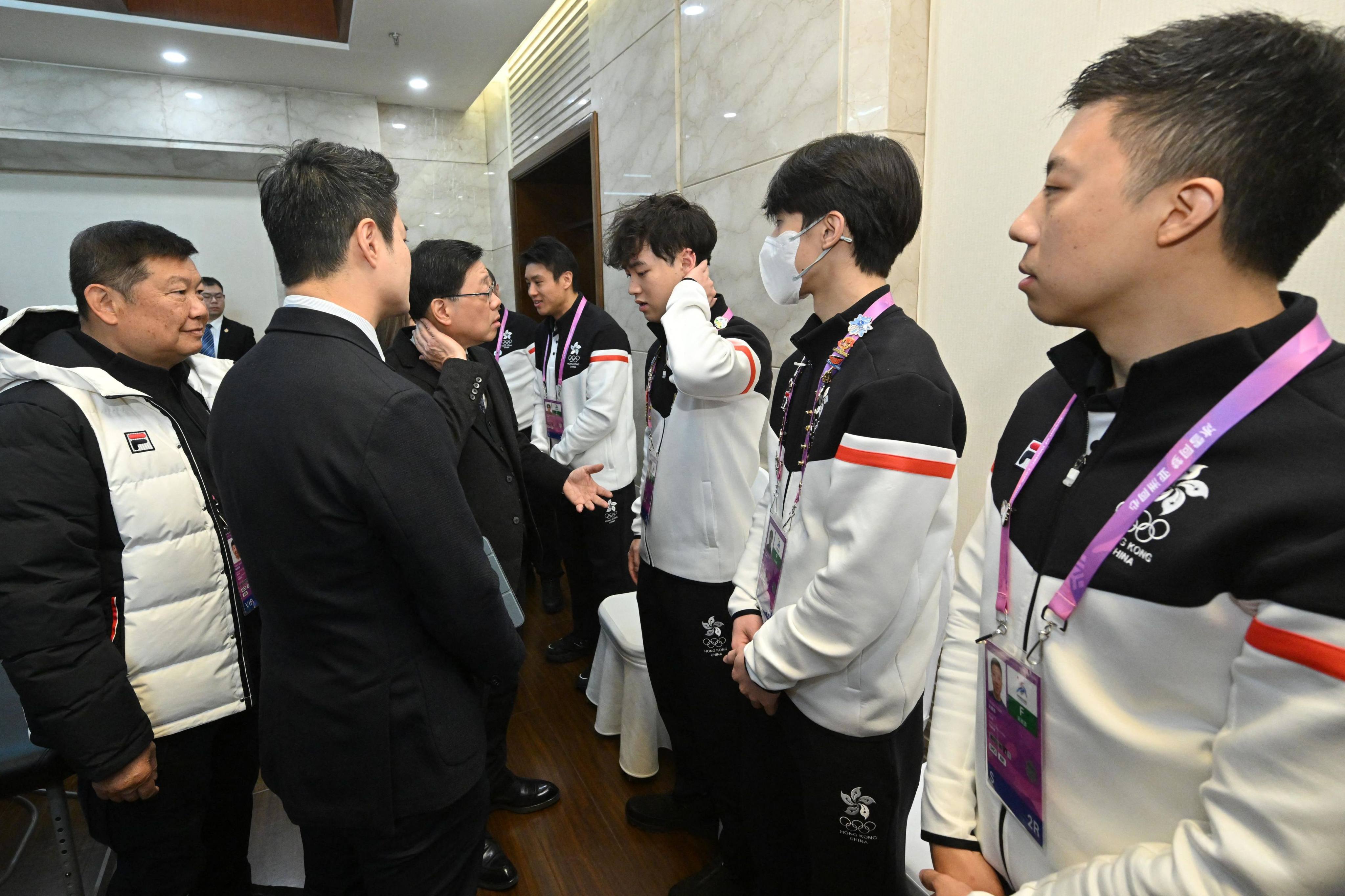 Hong Kong Chief Executive John Lee meets injured players from Hong Kong’s men’s ice hockey team during the Harbin 2025 Asian Winter Games in Harbin on Monday. Photo: Hong Kong Information Services Department via AFP