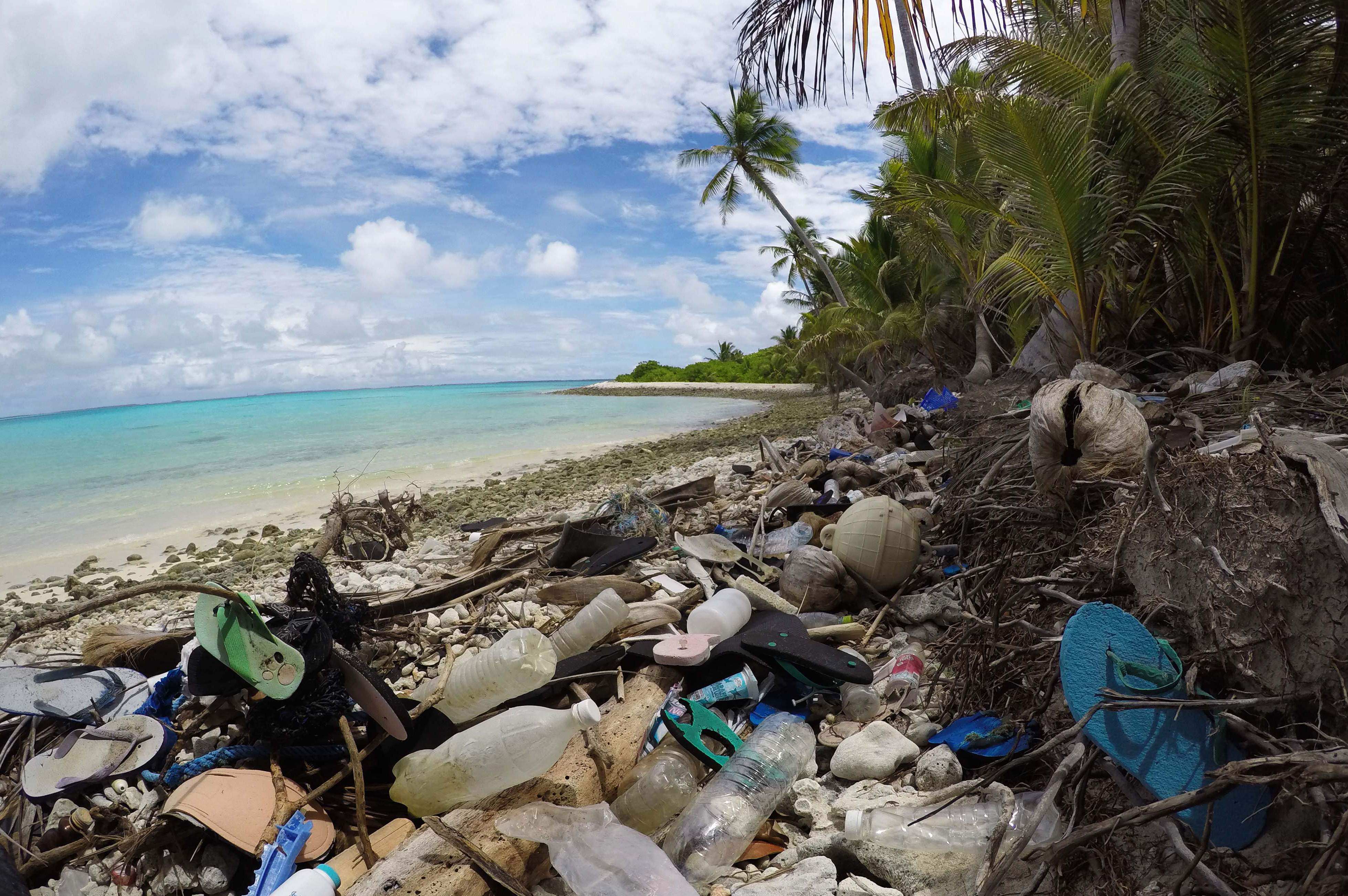 A beach on Cocos Islands is seen strewn with flotsam, jetsam and plastic debris. Photo: University of Tasmania/AFP