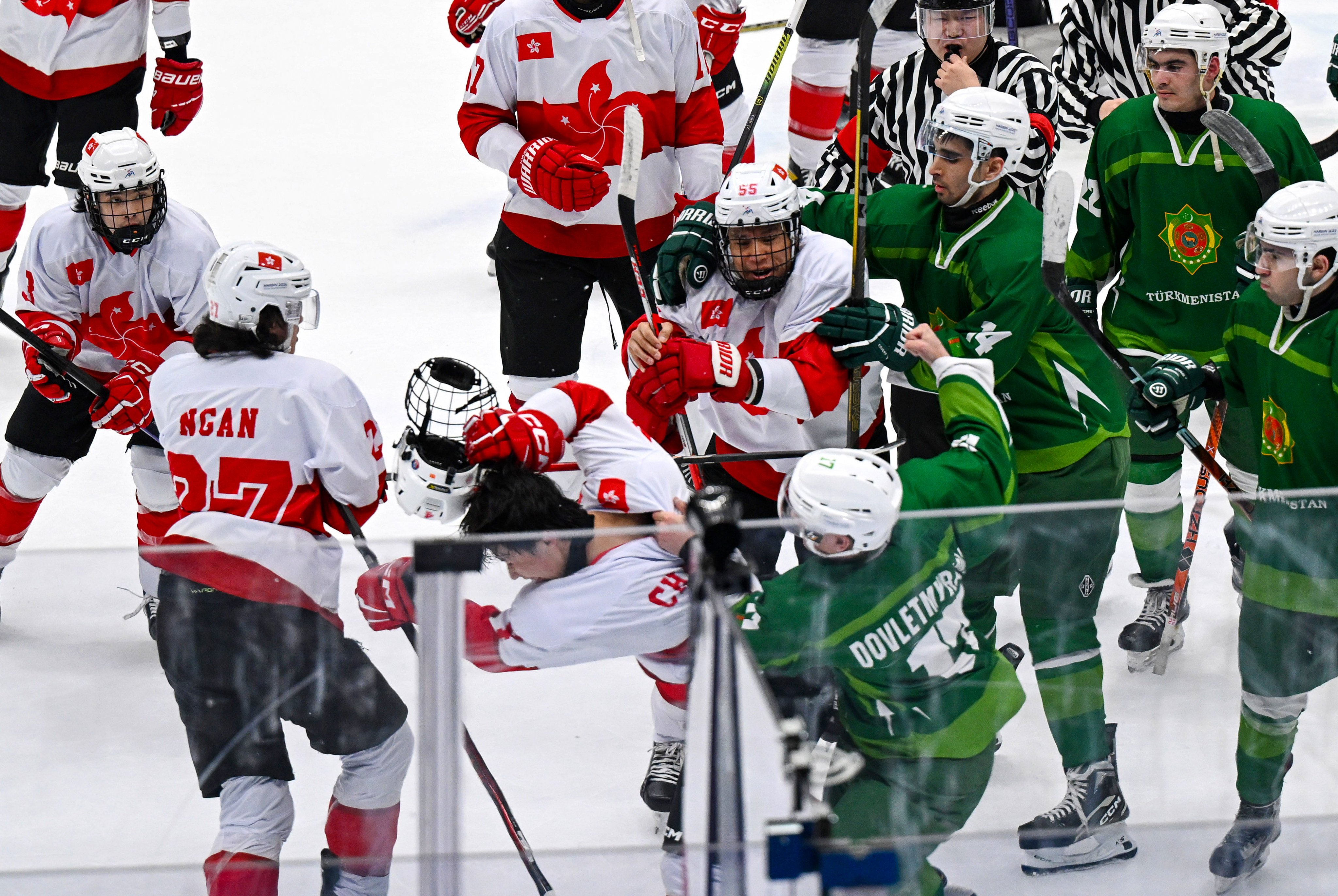 Turkmenistan’s Begench Dovletmyradov (right) throws a punch during the incident at the Asian Winter Games in Harbin. Photo: Xinhua