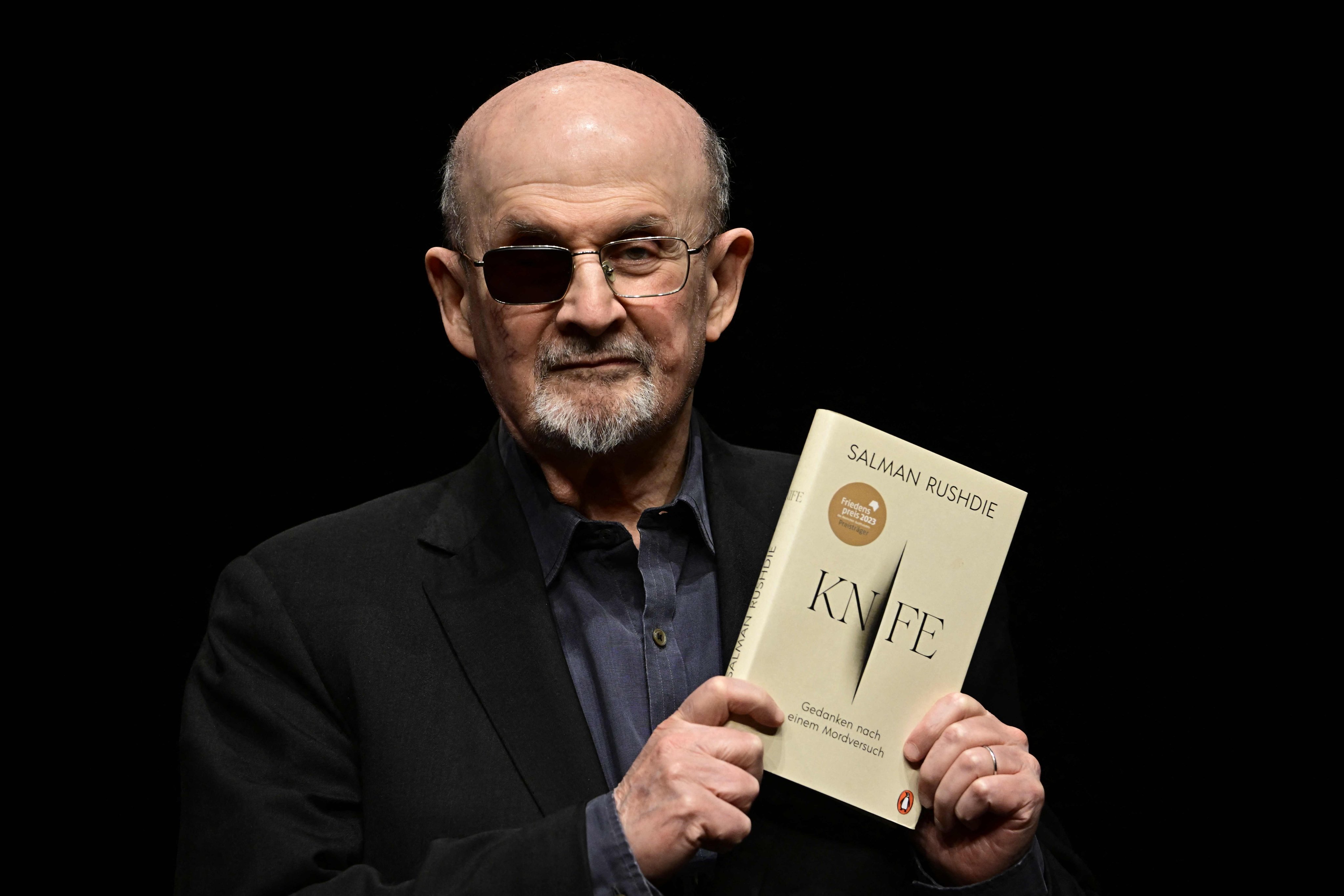 Author Salman Rushdie with his book Knife: Meditations After an Attempted Murder. Photo: AFP