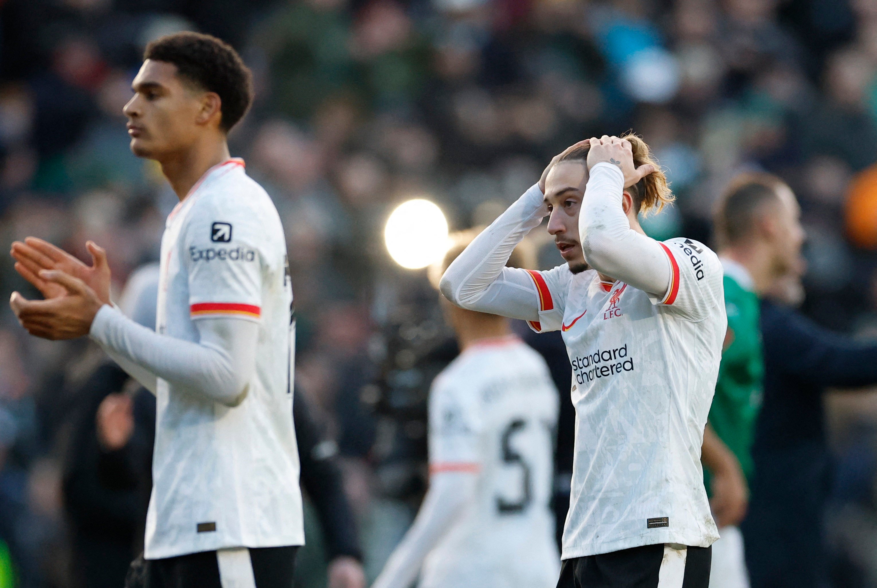 Liverpool’s Kostas Tsimikas (right) looks dejected after his side’s stunning defeat to Plymouth in the FA Cup. Photo: Reuters