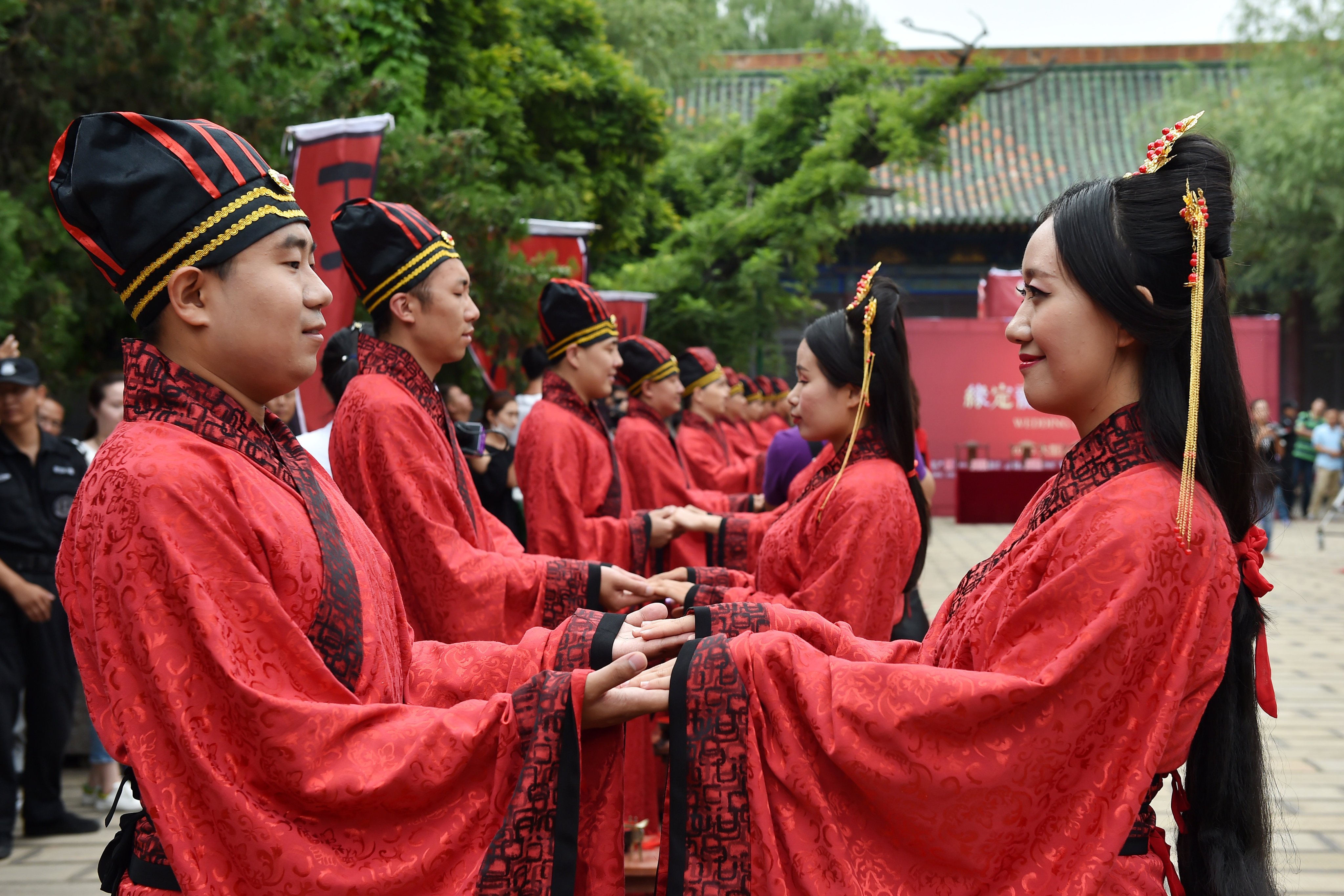 Couples take part in a mass wedding at a Confucian temple in Taiyuan, Shanxi province. China’s number of marriage registrations plunged over 20 per cent in 2024, exacerbating the country’s demographic crisis. Photo: Xinhua