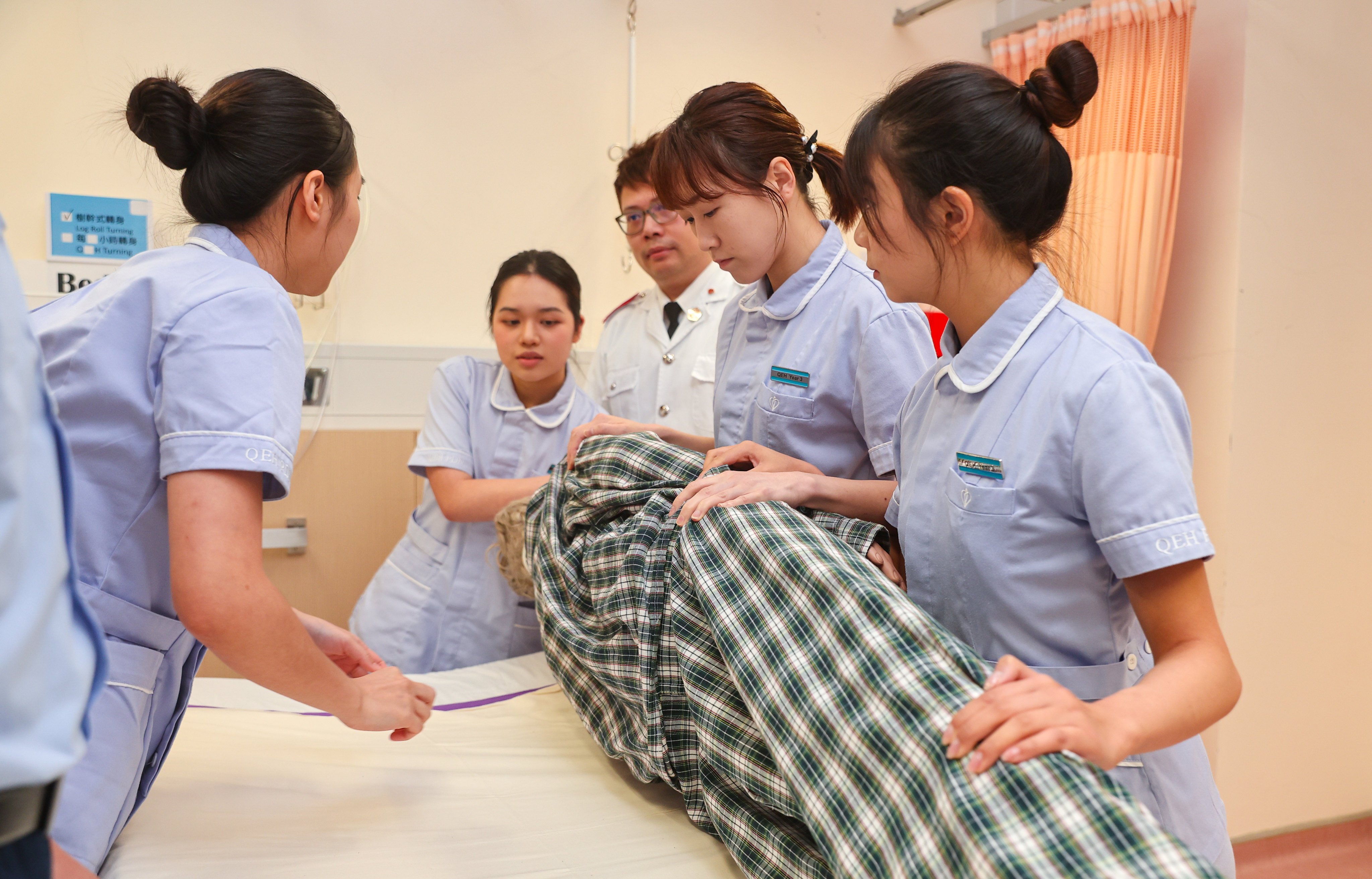 Trainees perform a demonstration for a nursing course at Queen Elizabeth Hospital. Photo: Edmond So