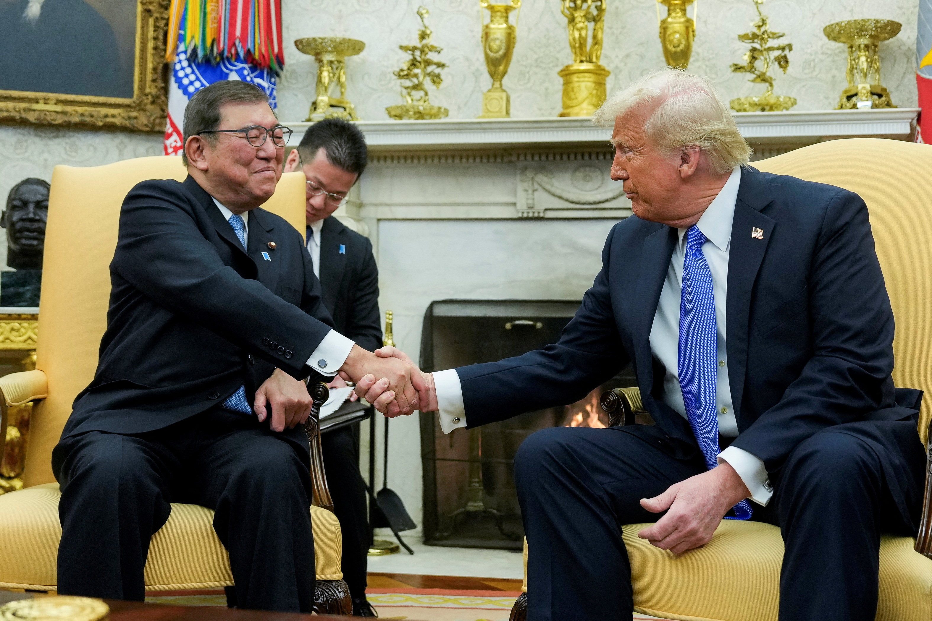 US President Donald Trump shakes hands with Japan’s Prime Minister Shigeru Ishiba at the White House in Washington on Friday. Photo: Reuters 