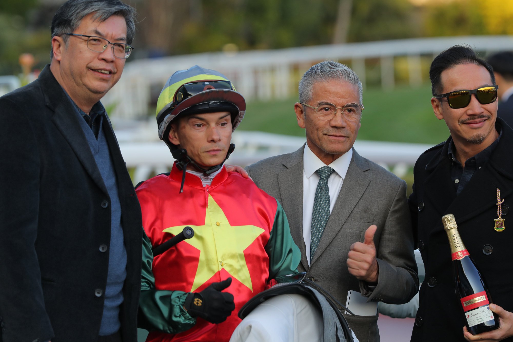 Jockey Alexis Badel and trainer Tony Cruz (second from right) team up again on Wednesday night.